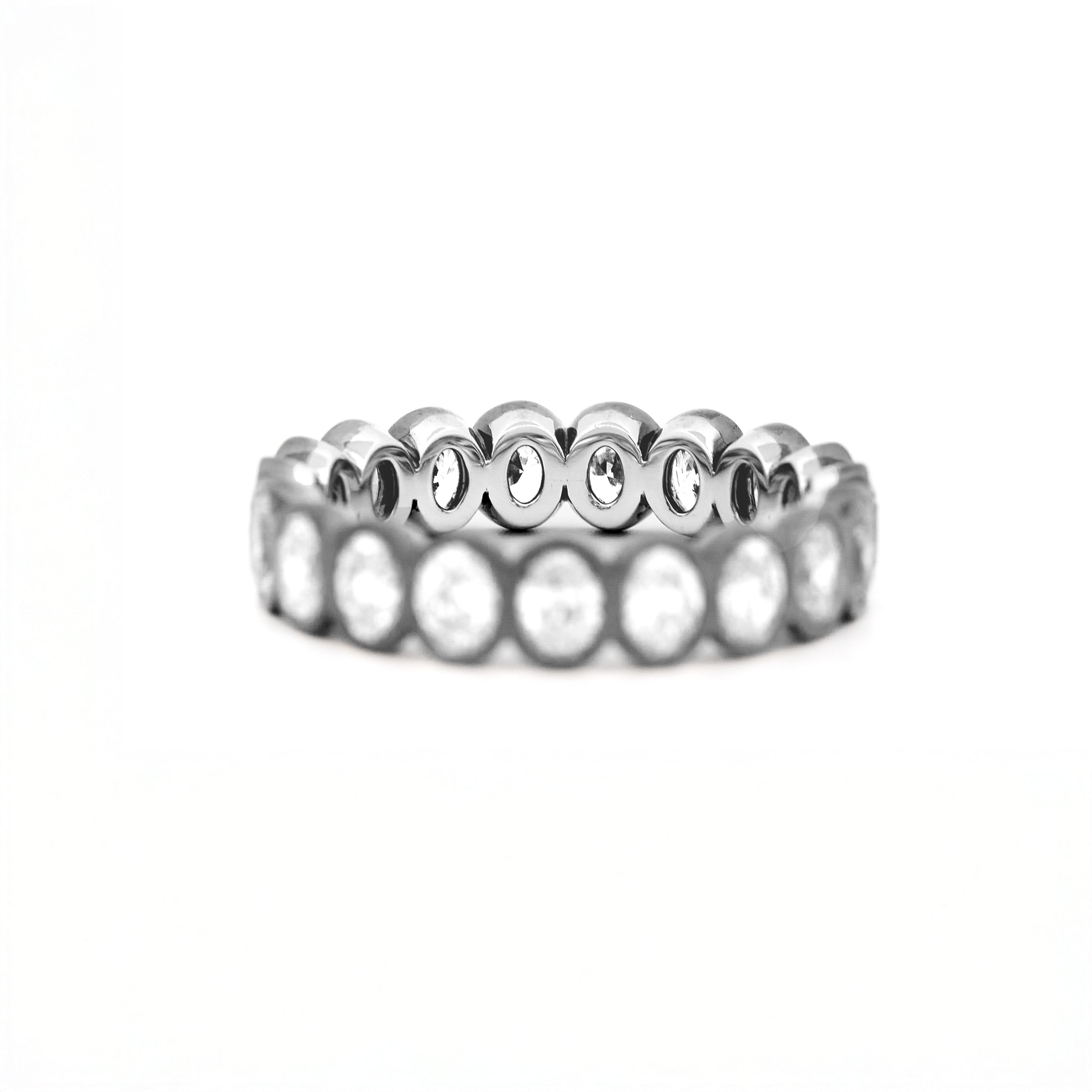 Two tone gold ring, eternity diamonds, on a white background