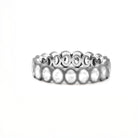 Two tone gold ring, eternity diamonds, on a white background
