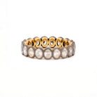 Two tone gold ring, eternity diamonds, on a white background