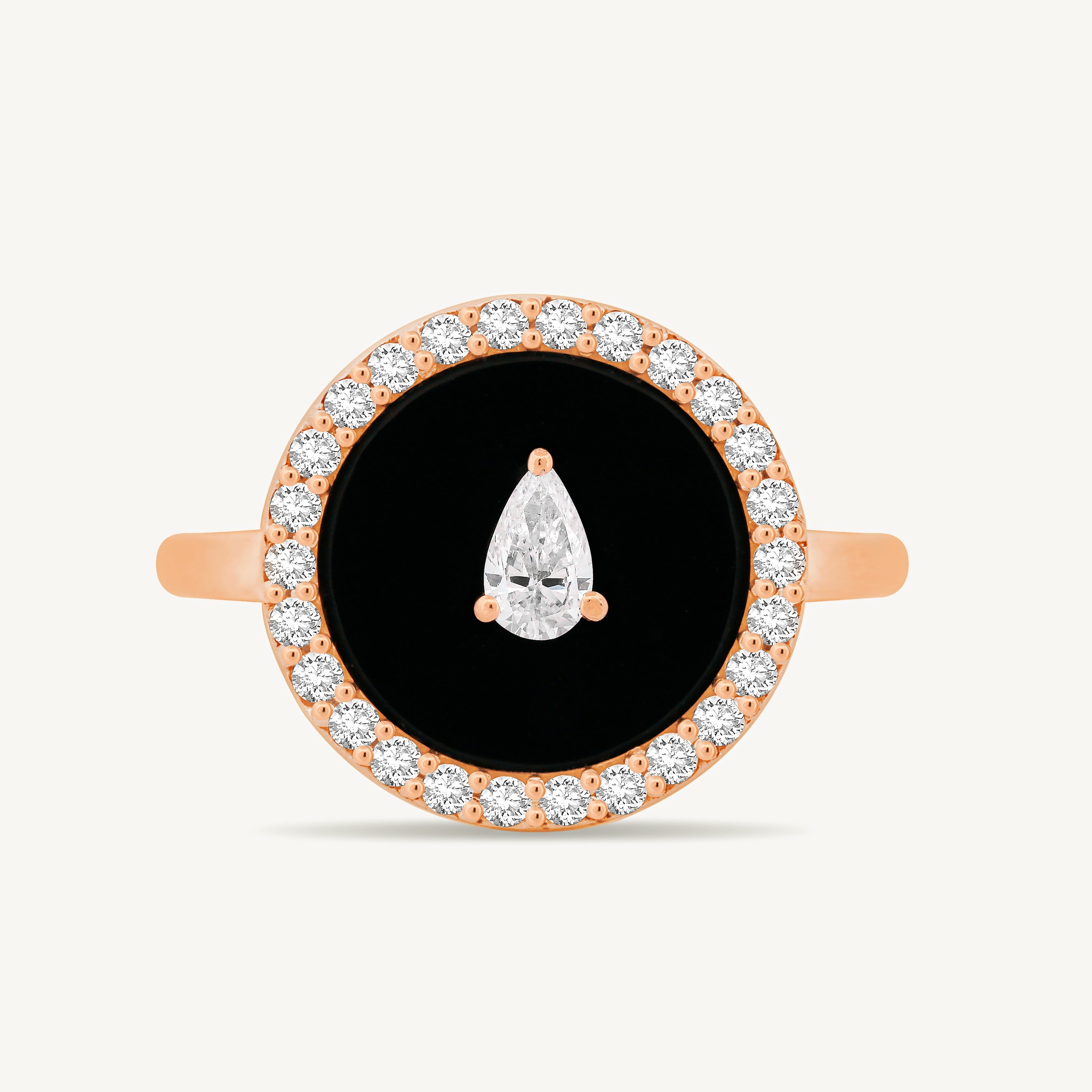 Rose gold ring with black onyx center and diamond accents on a white background