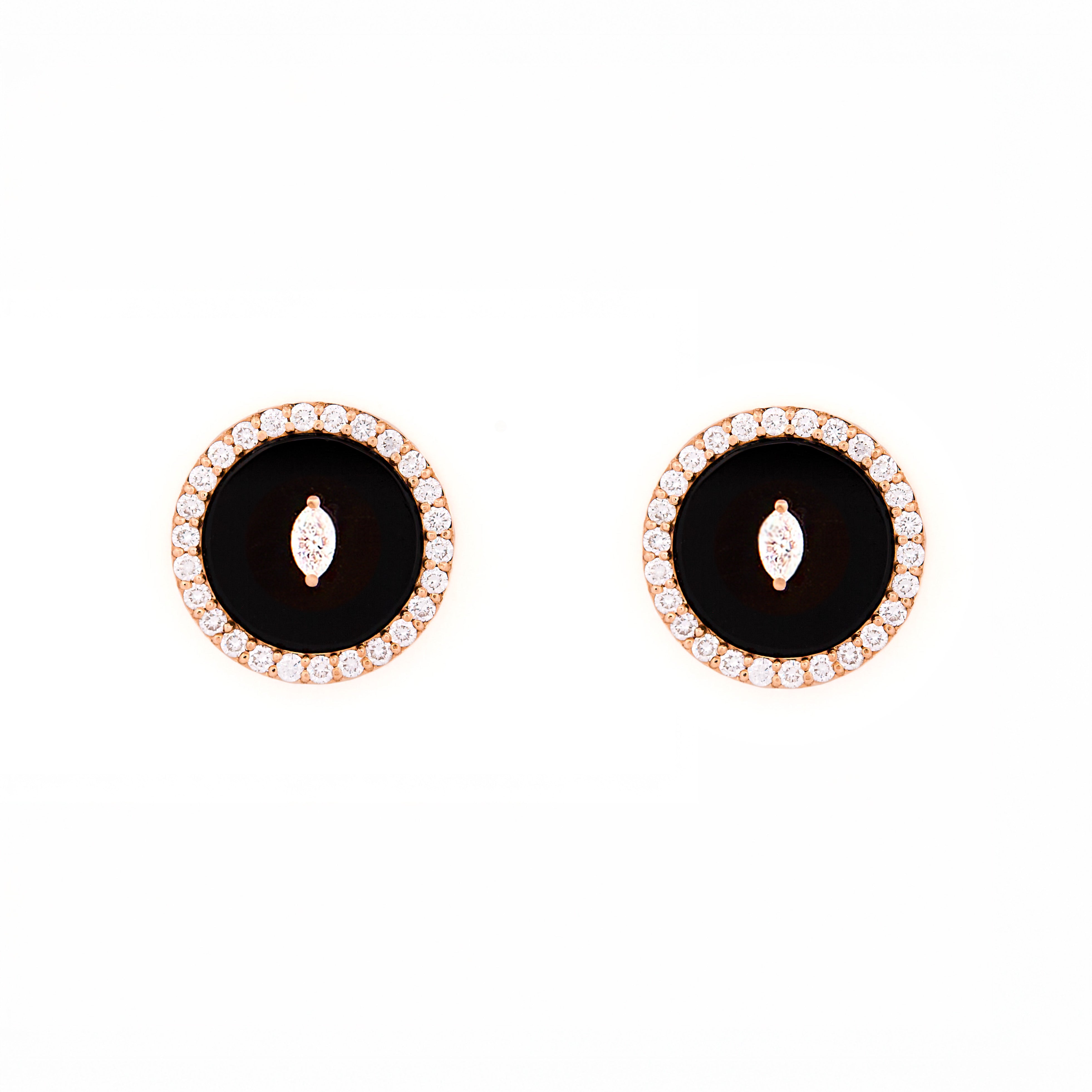 Pair of earrings with black onyx center stone and diamond marquise and round shape accents on a white background