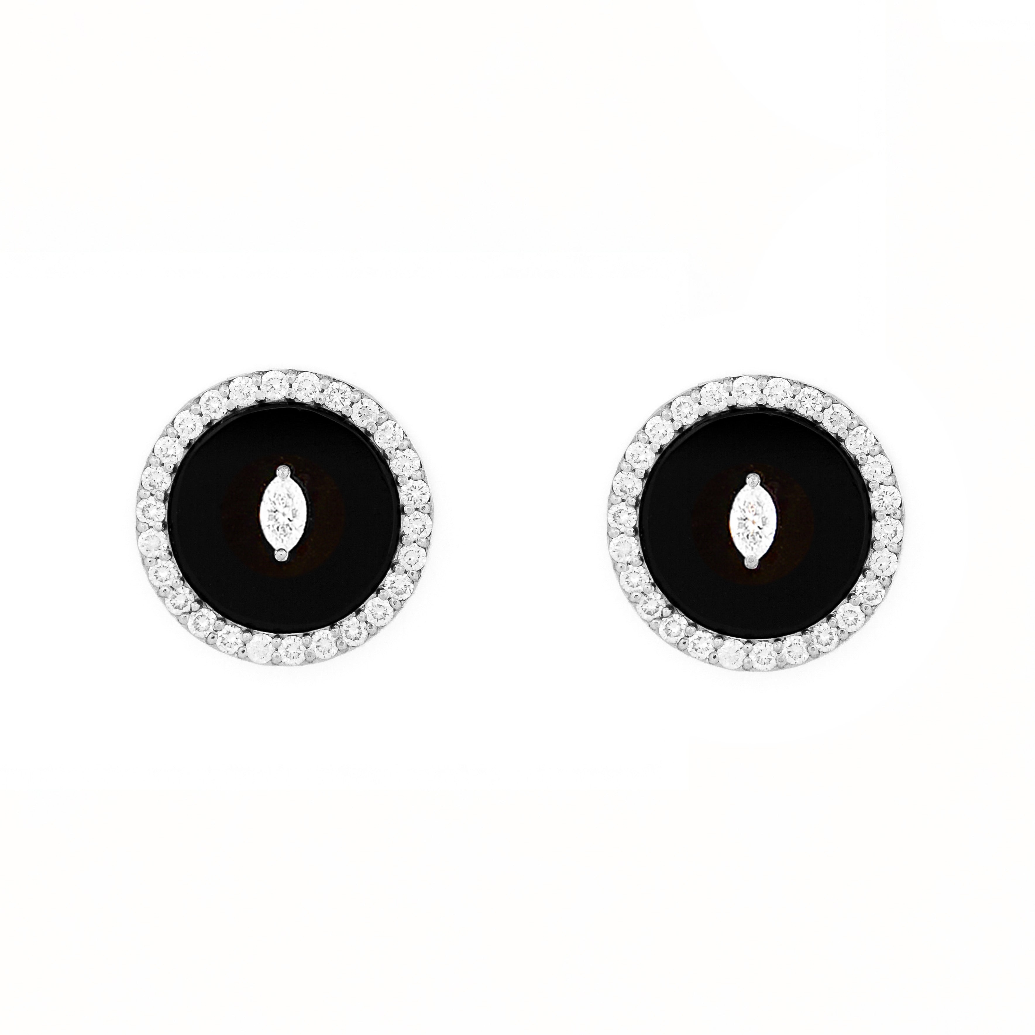 Pair of earrings with black onyx center stone and diamond marquise and round shape accents on a white background