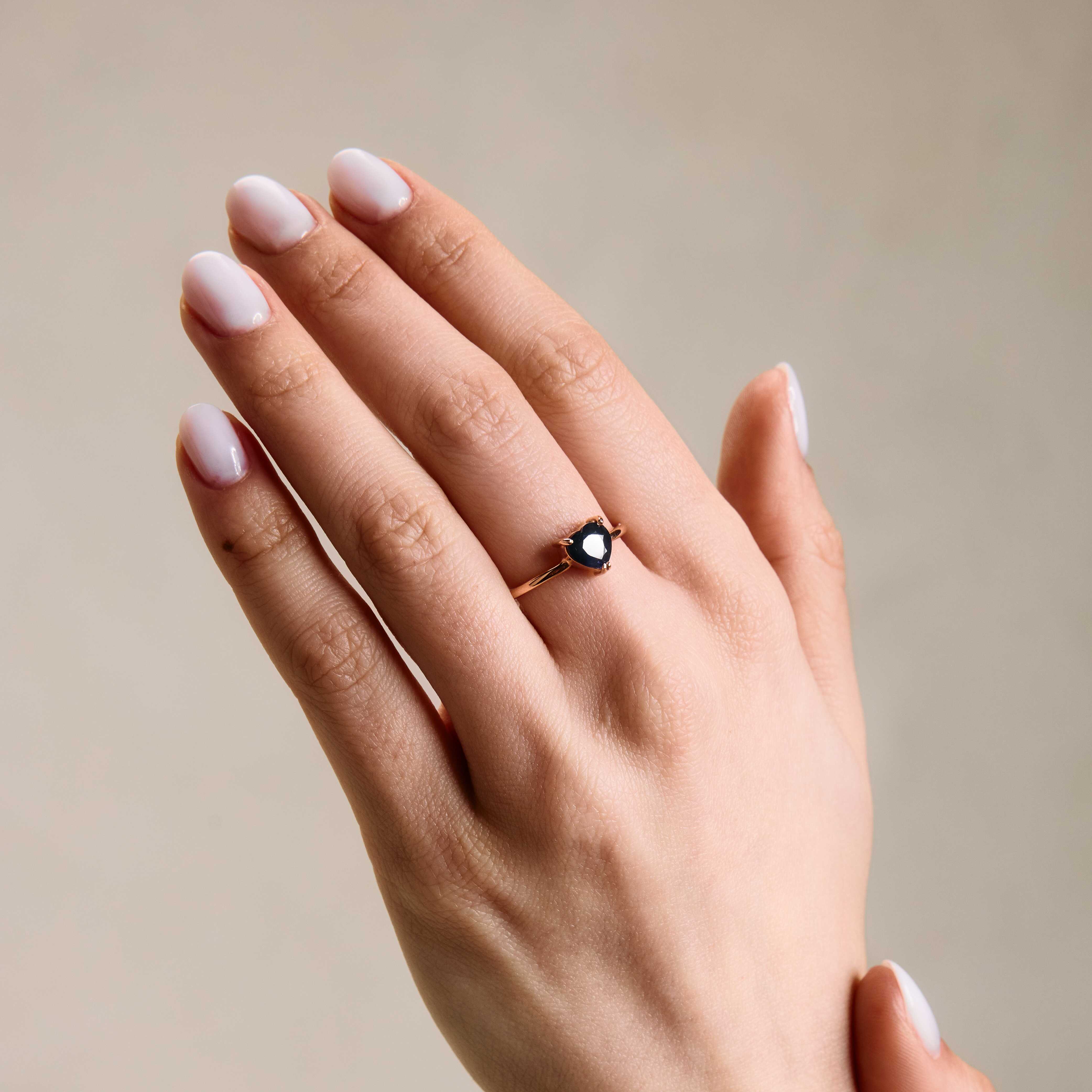 Sapphire heart ring on hand