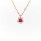 Rose gold necklace with a floral pendant on a white background