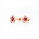 beautiful gold cherry blossom flower earrings on white background 