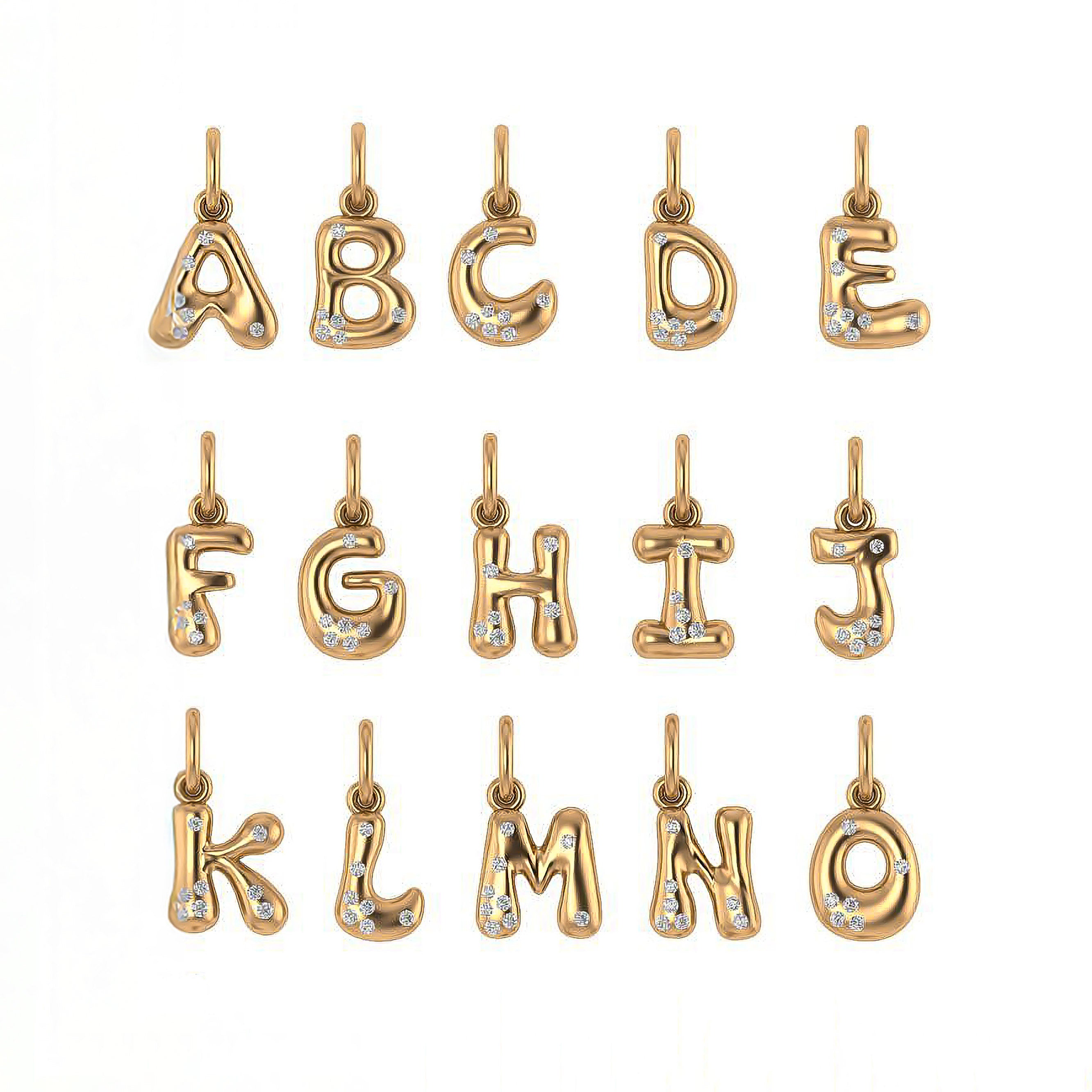 Gold letter and sprinkled diamonds pendants from A to O on a white background