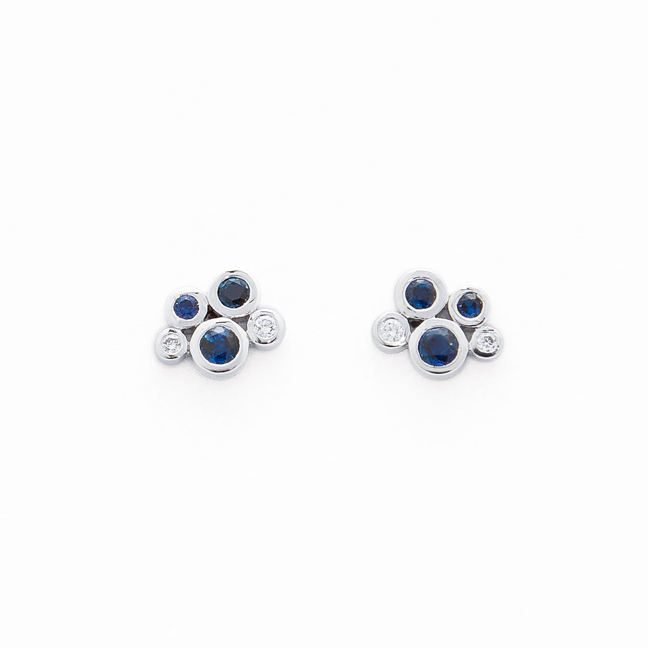 gold stud earrings with blue sapphires and white diamond cluster design.