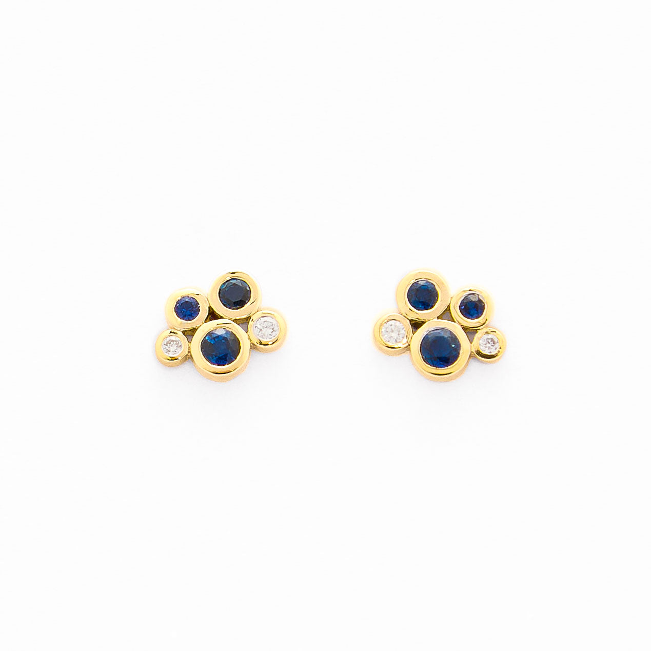 gold stud earrings with blue sapphires and white diamond cluster design.