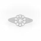 White gold ring with diamond cluster daisy flower on a white background