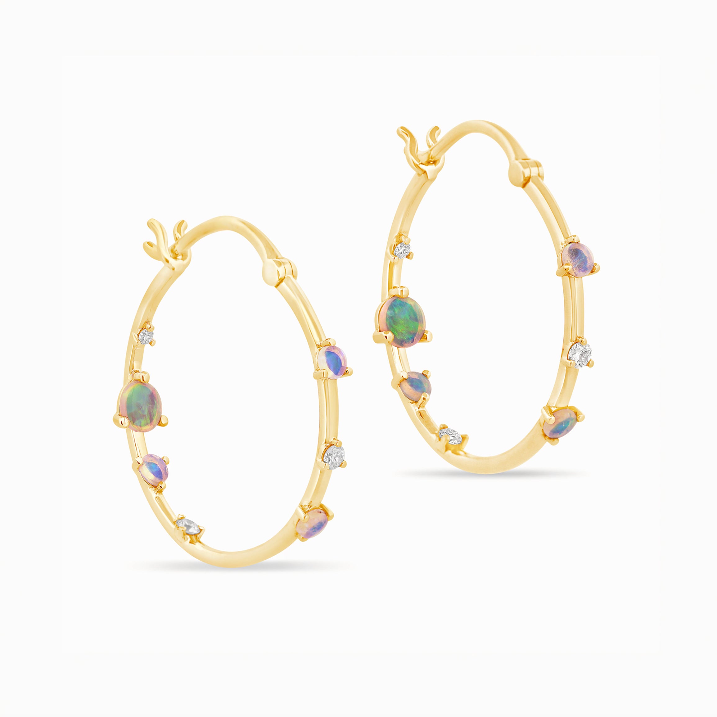 Gold hoop earrings with embedded Australian opals and diamonds on a white background.