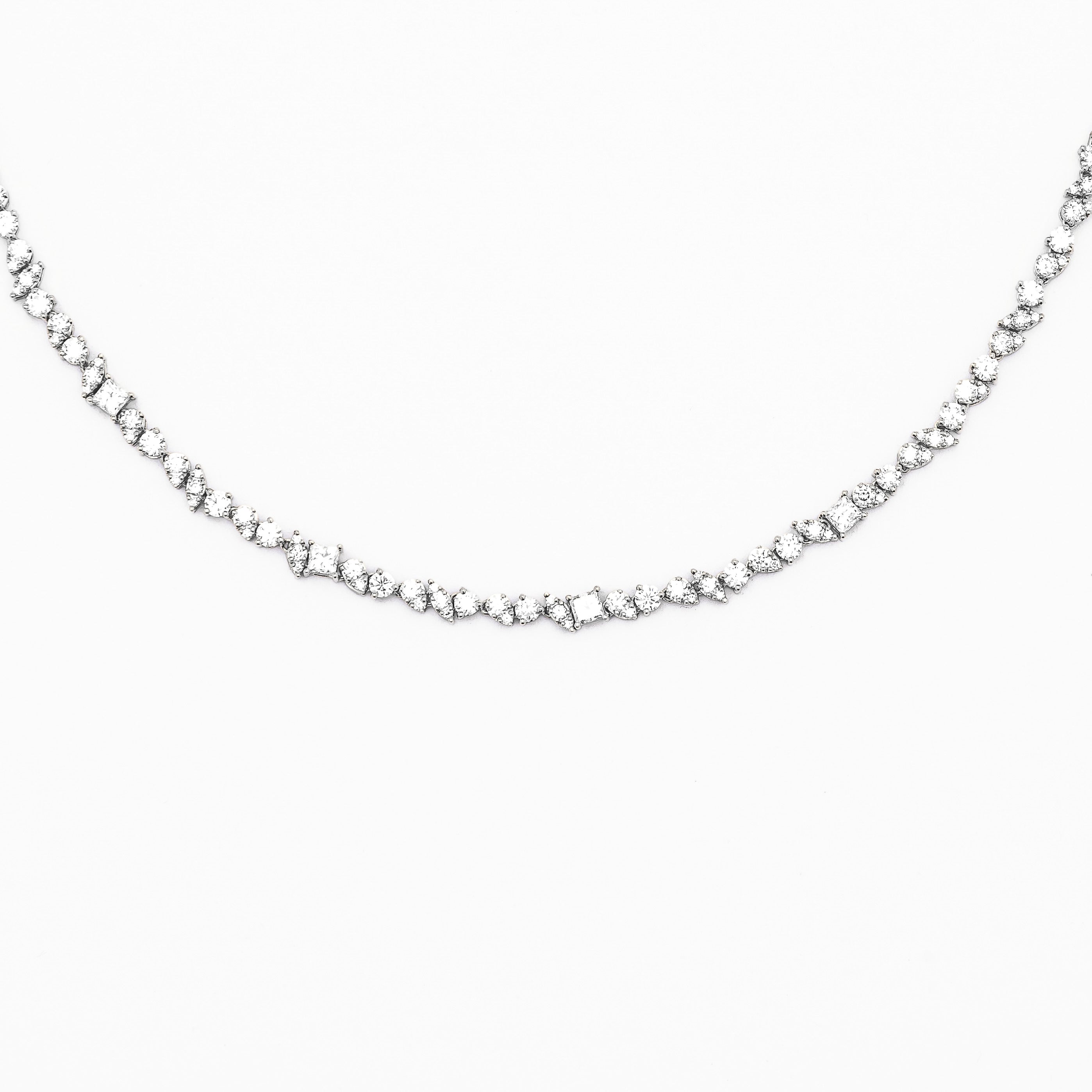 An 18k gold diamond-adorned half tennis choker necklace.