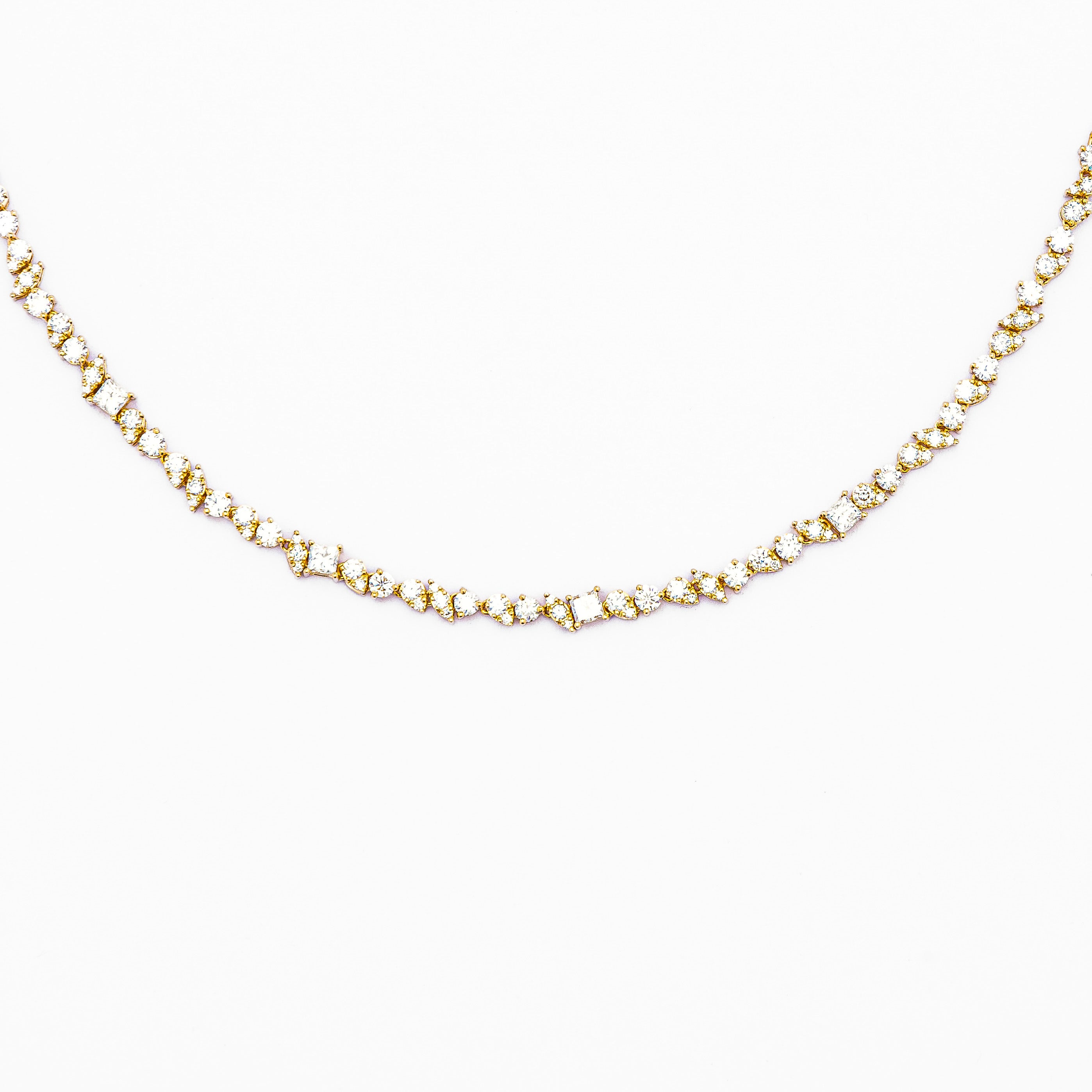 An 18k gold diamond-adorned half tennis choker necklace.