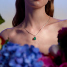The Great - Emerald and diamonds pendant on model and beautiful flowers. Pandantul The Great cu smarald si diamante pe model și flori superbe. 
