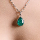 The Great - Emerald and diamonds pendant on model. Pandantul The Great cu smarald si diamante pe model. 