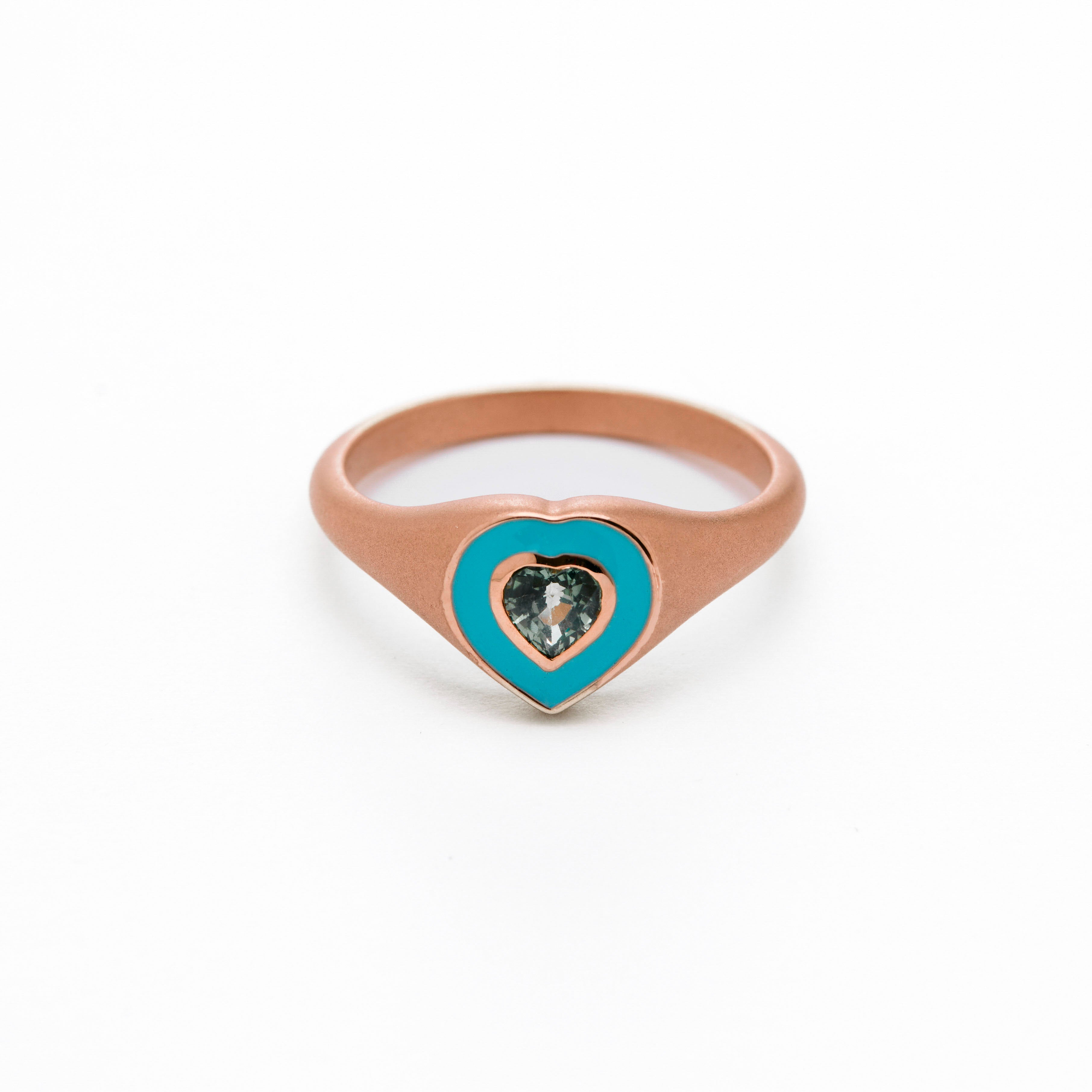  colorful enamel ring with sapphire green heart middle stone.