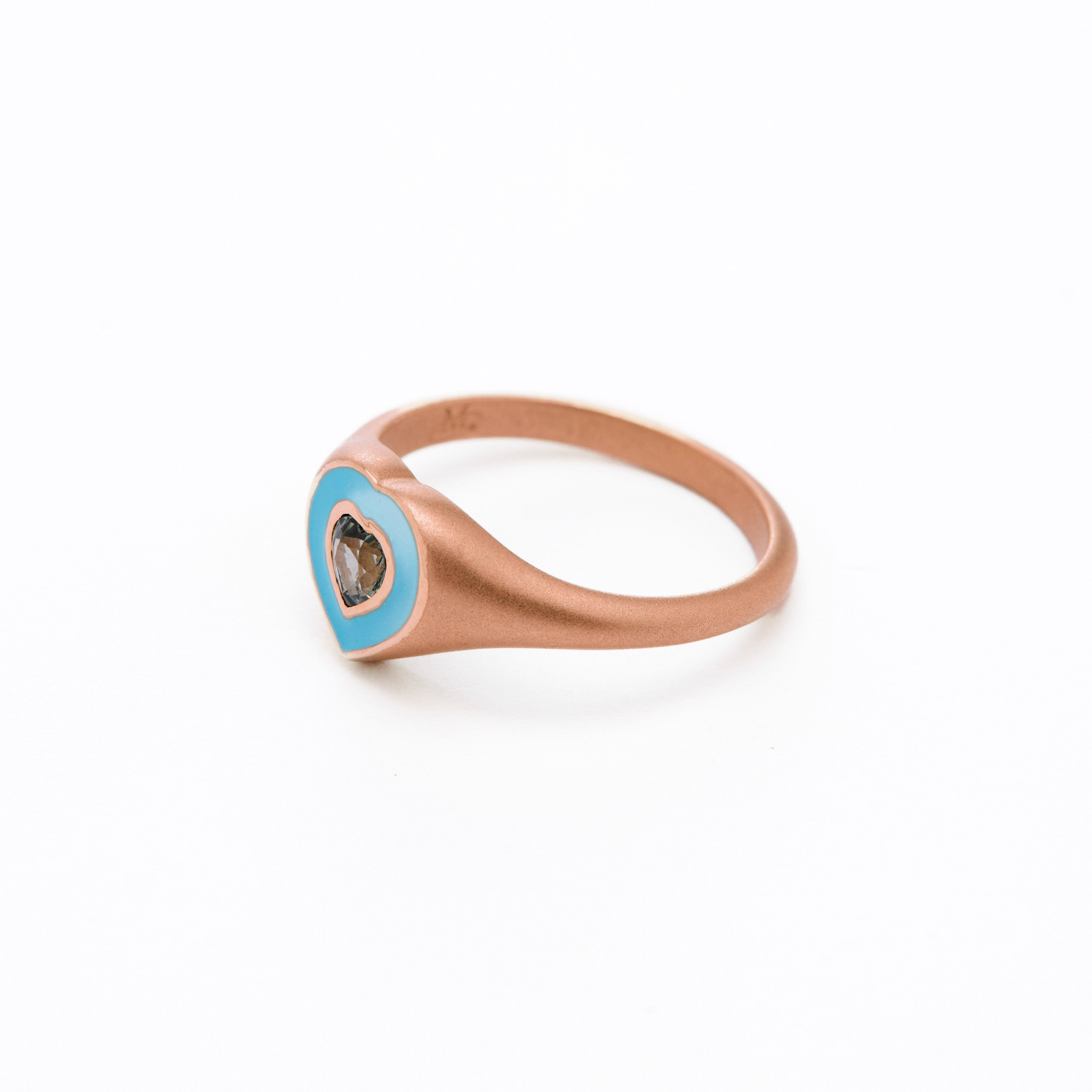  colorful enamel ring with sapphire green heart middle stone.