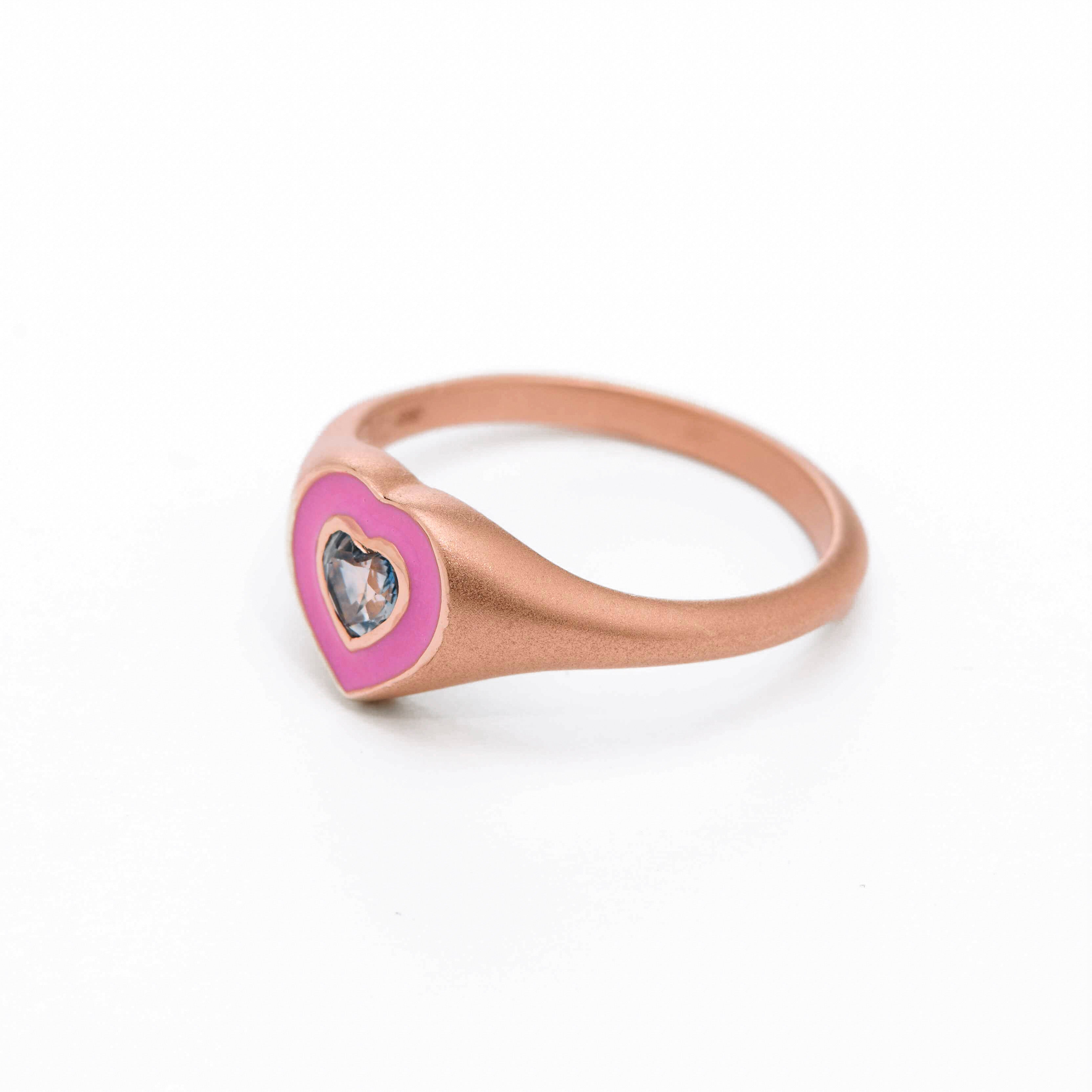 pink enamel ring with sapphire heart