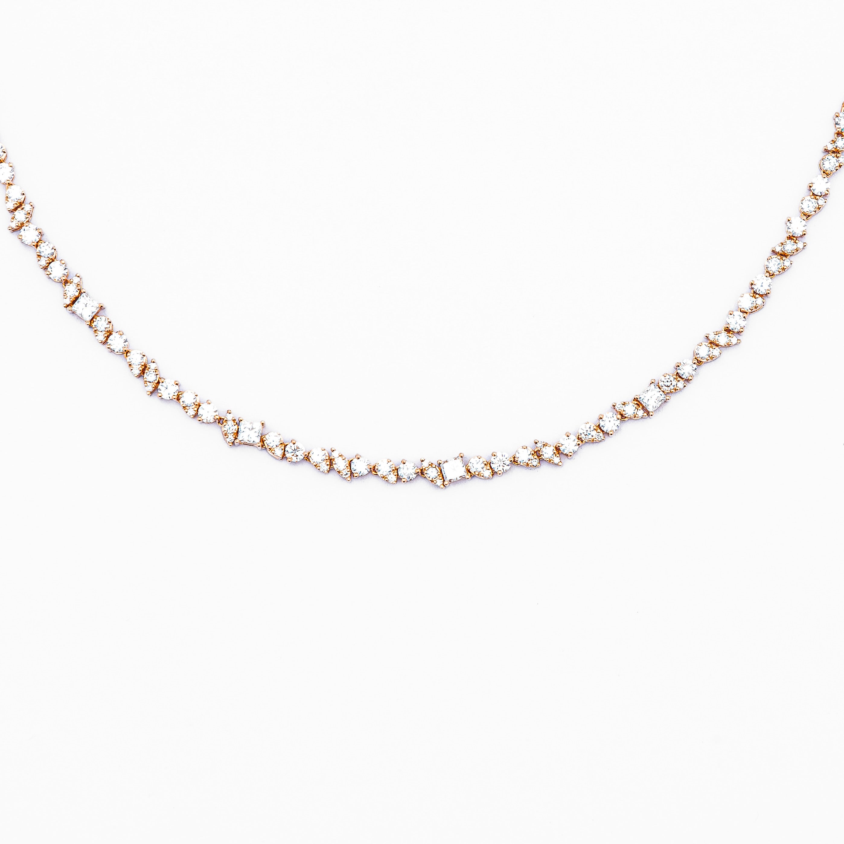 An 18k gold diamond-adorned half tennis choker necklace.