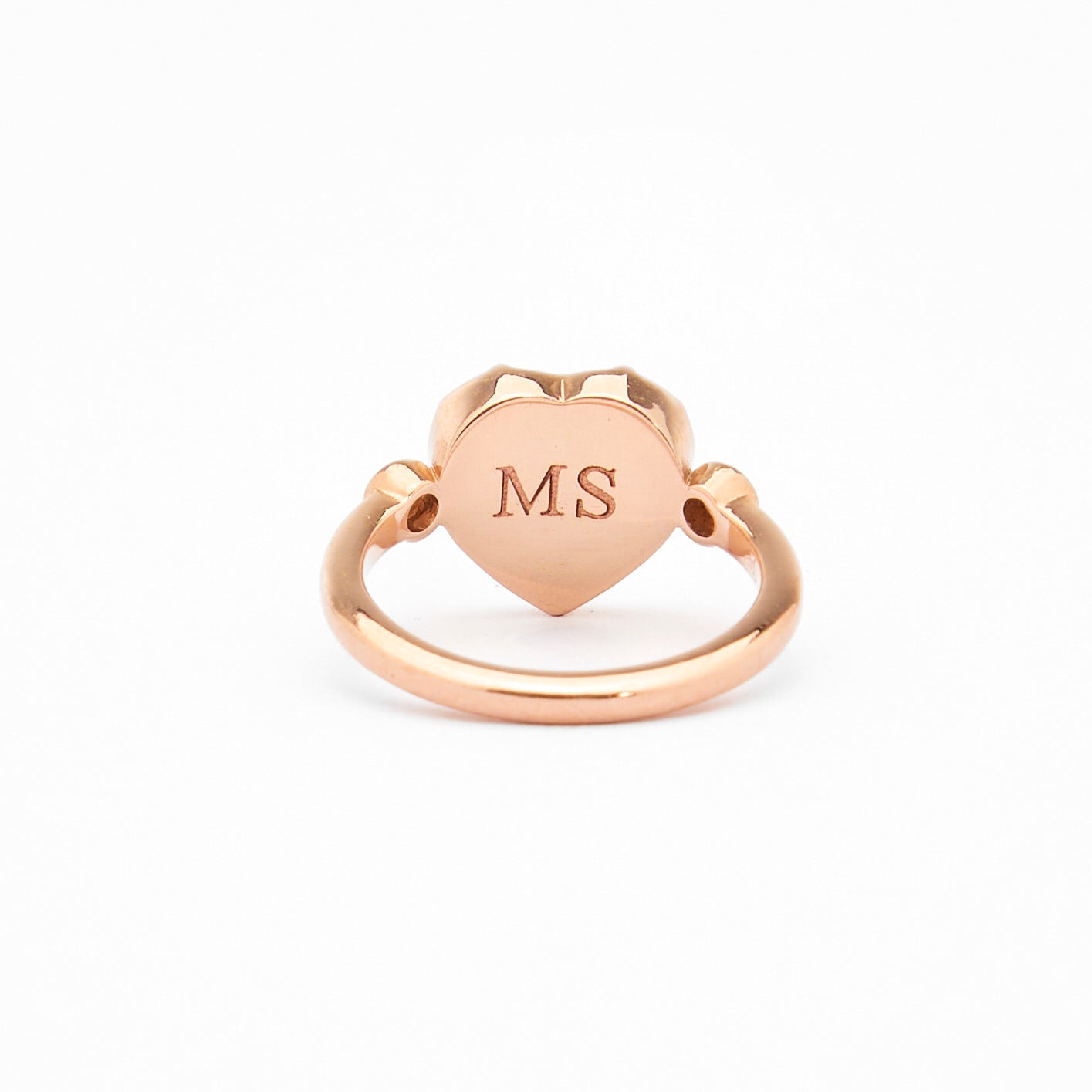 heart shaped gold rinng with back engraving

