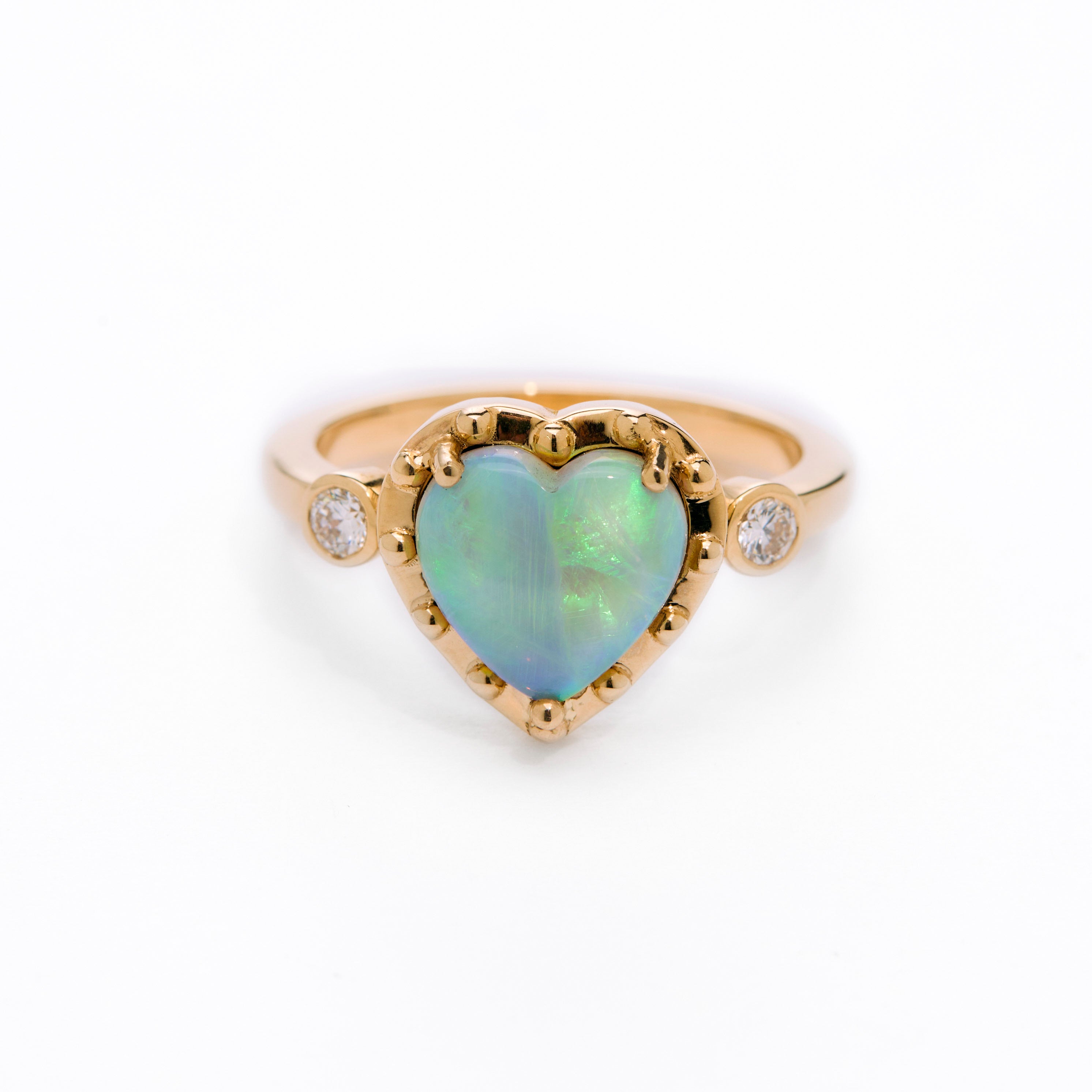 Australian Opal Heart Gold Ring on white background 