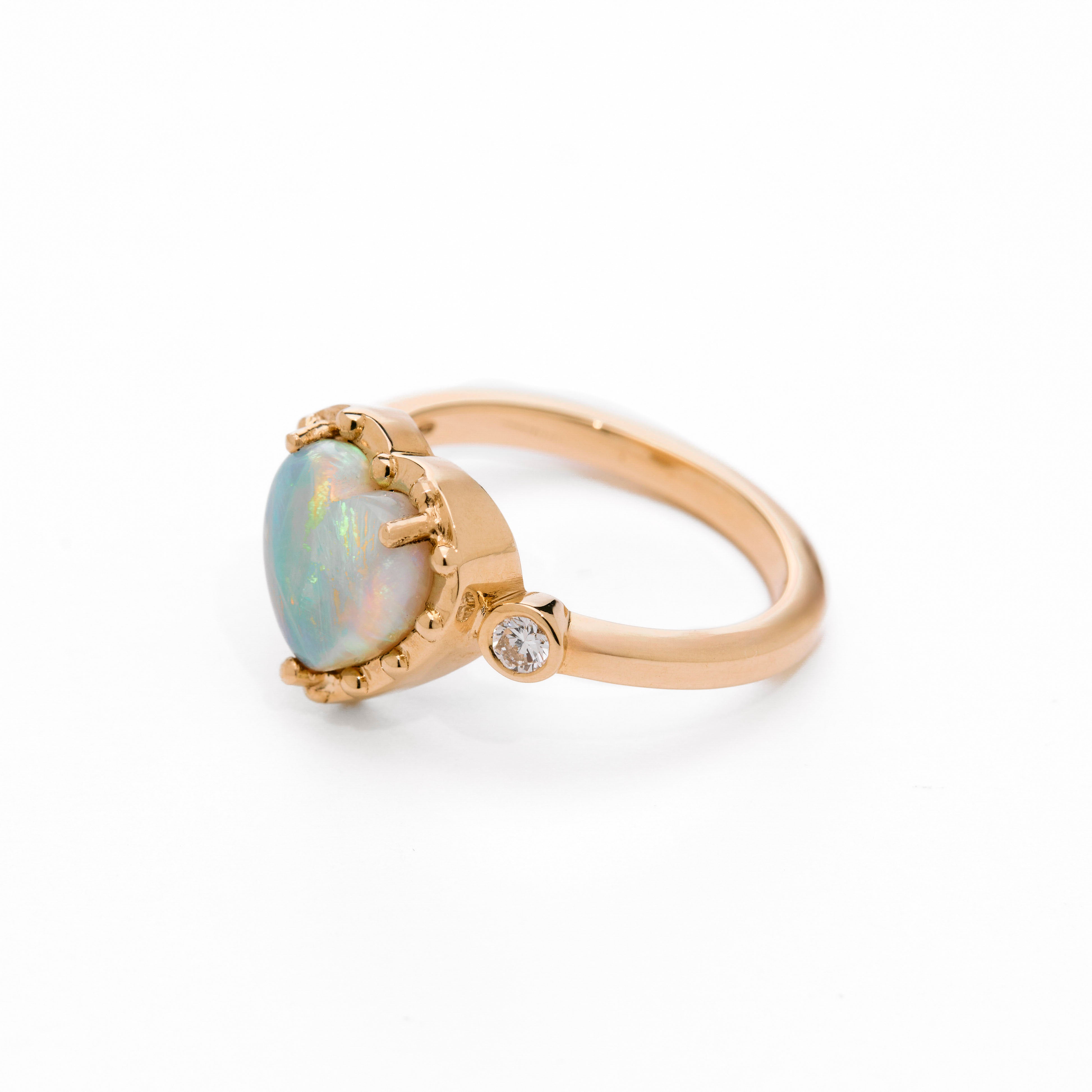 Australian Opal Heart Gold Ring on white background 