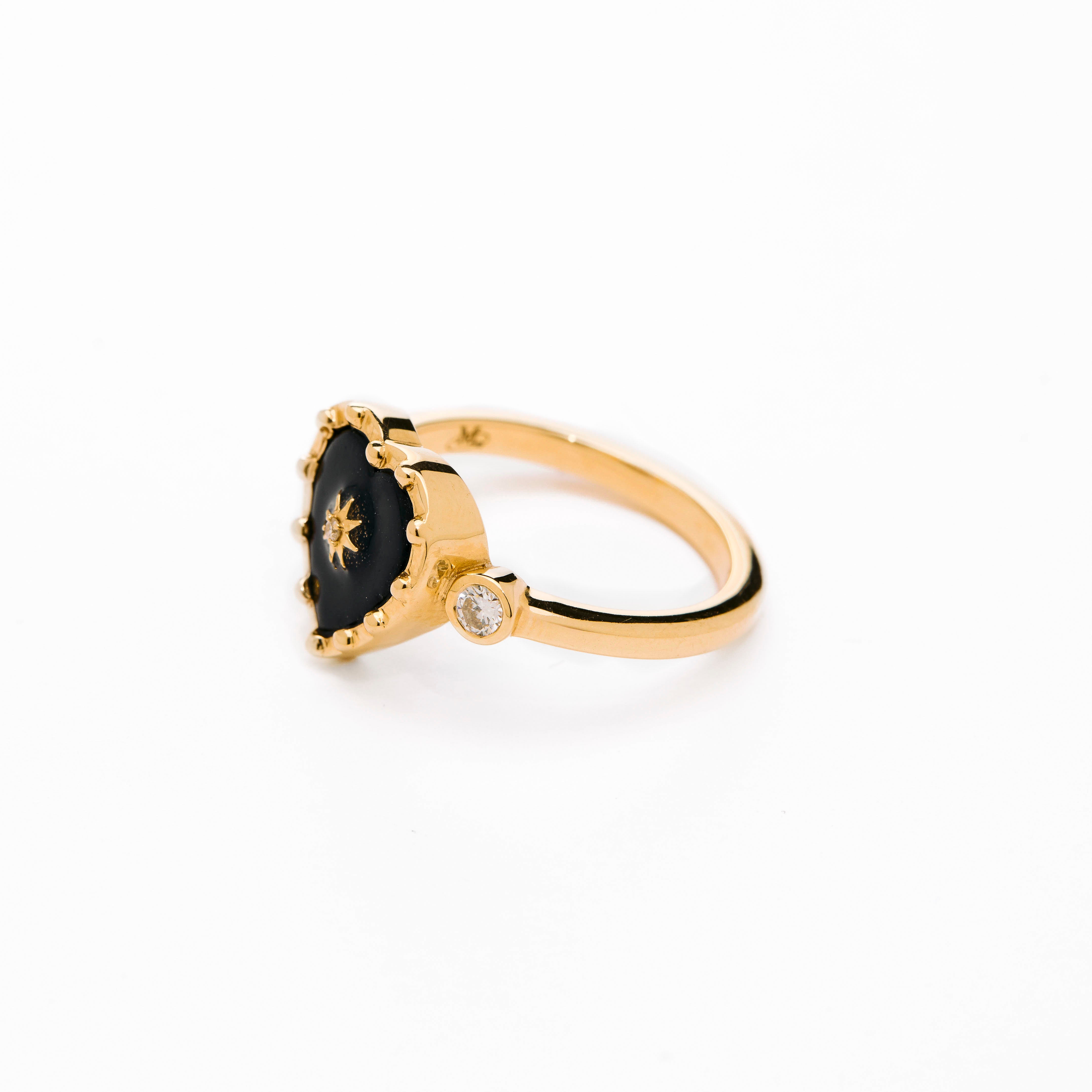 Heart shaped black onyx ring and 14k gold, with bezel diamonds, wear it for protection
