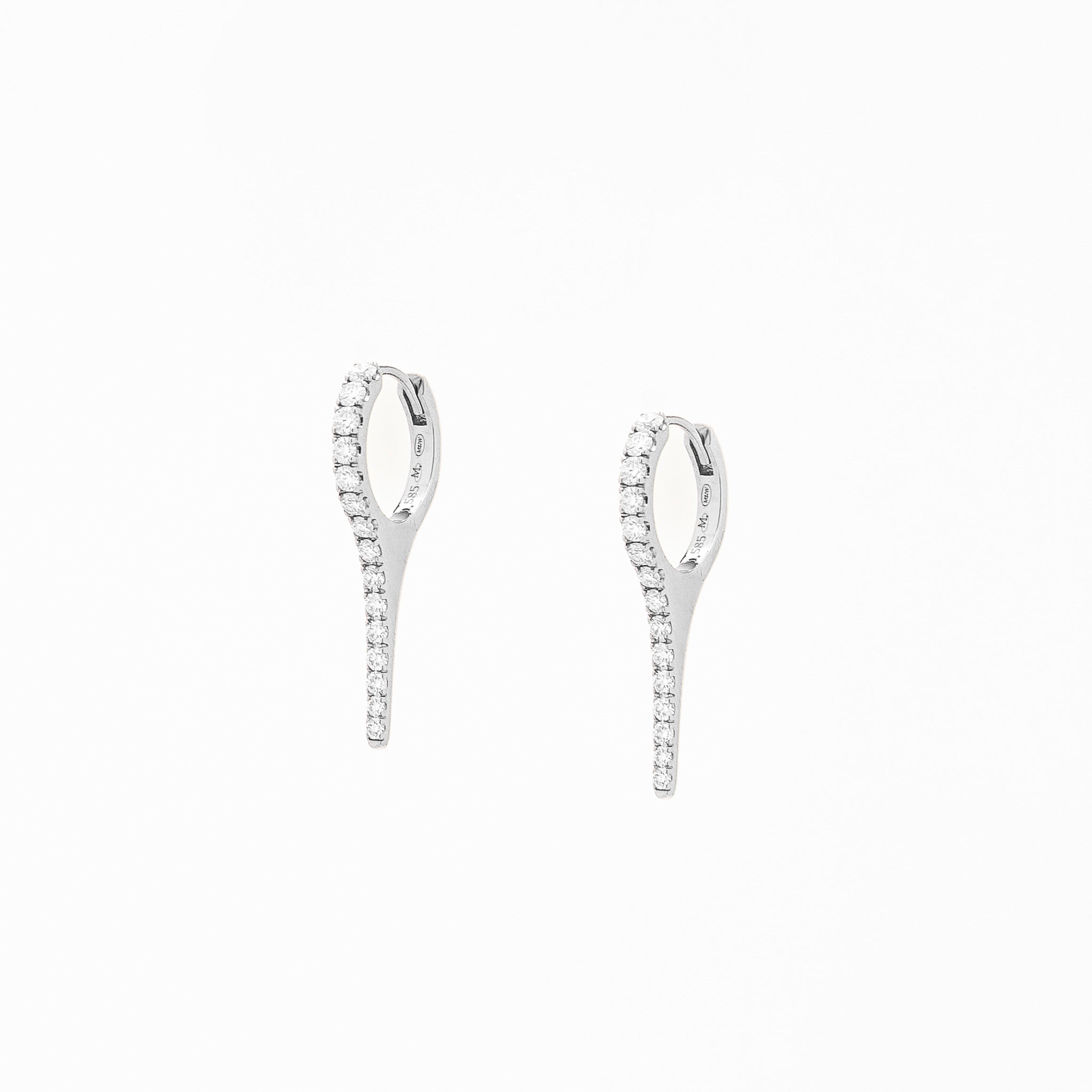 A pair of gold earrings with natural diamond drops, featuring a minimalist design.