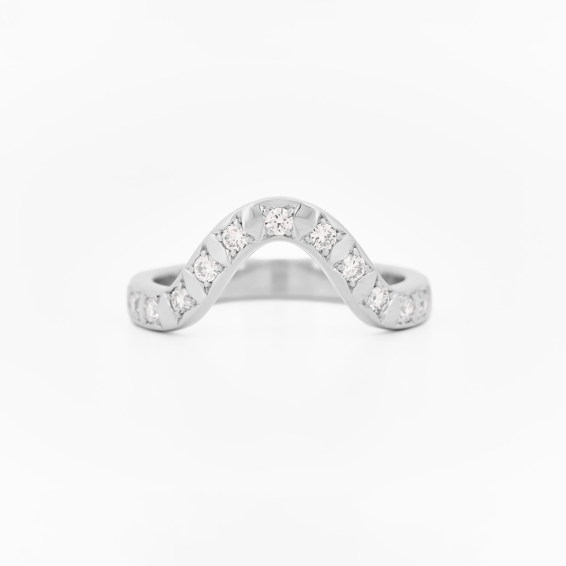 White gold 2.5 mm band ring with 3 round diamondsdiamonds on a white background.
