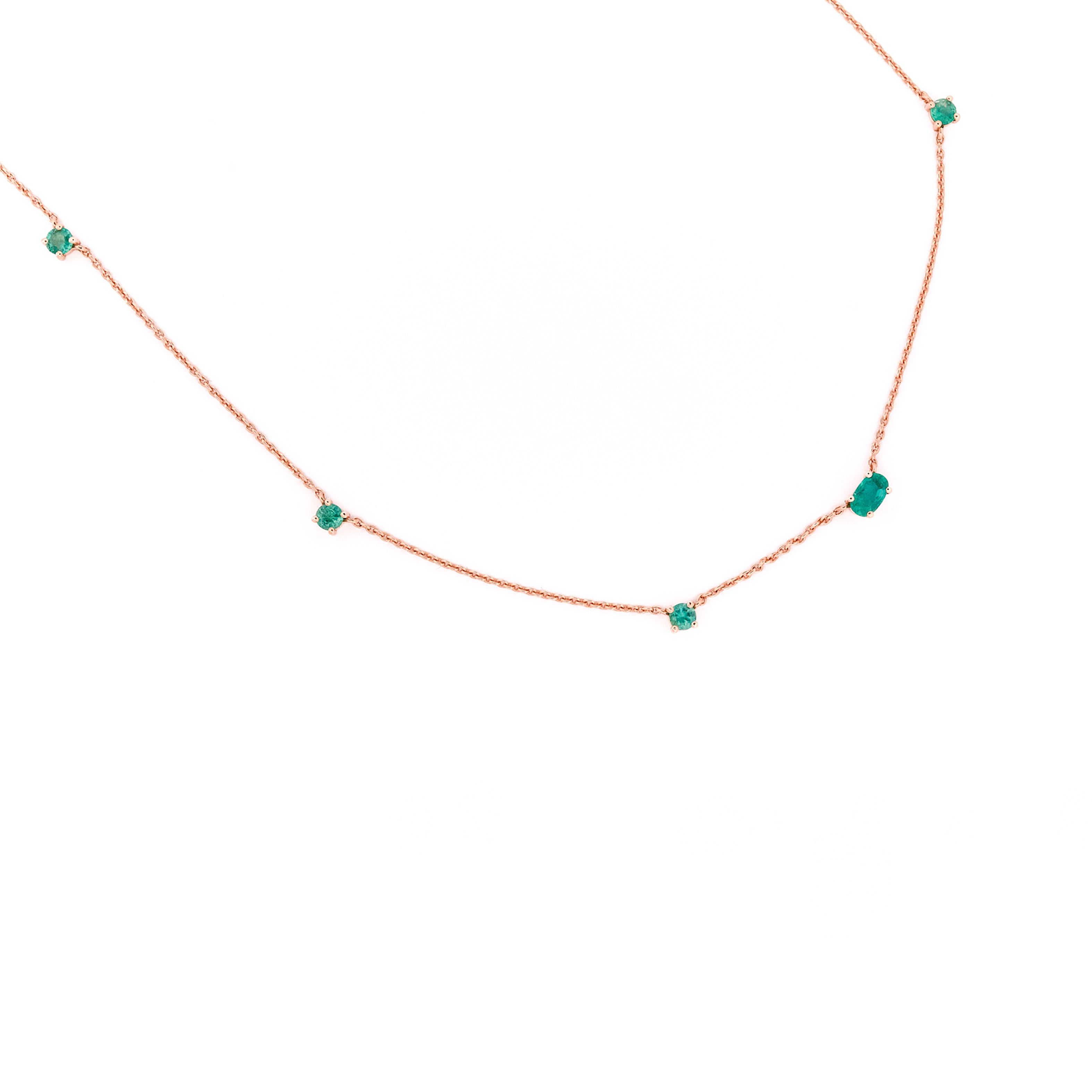 Necklace with emeralds gemstones on a white background