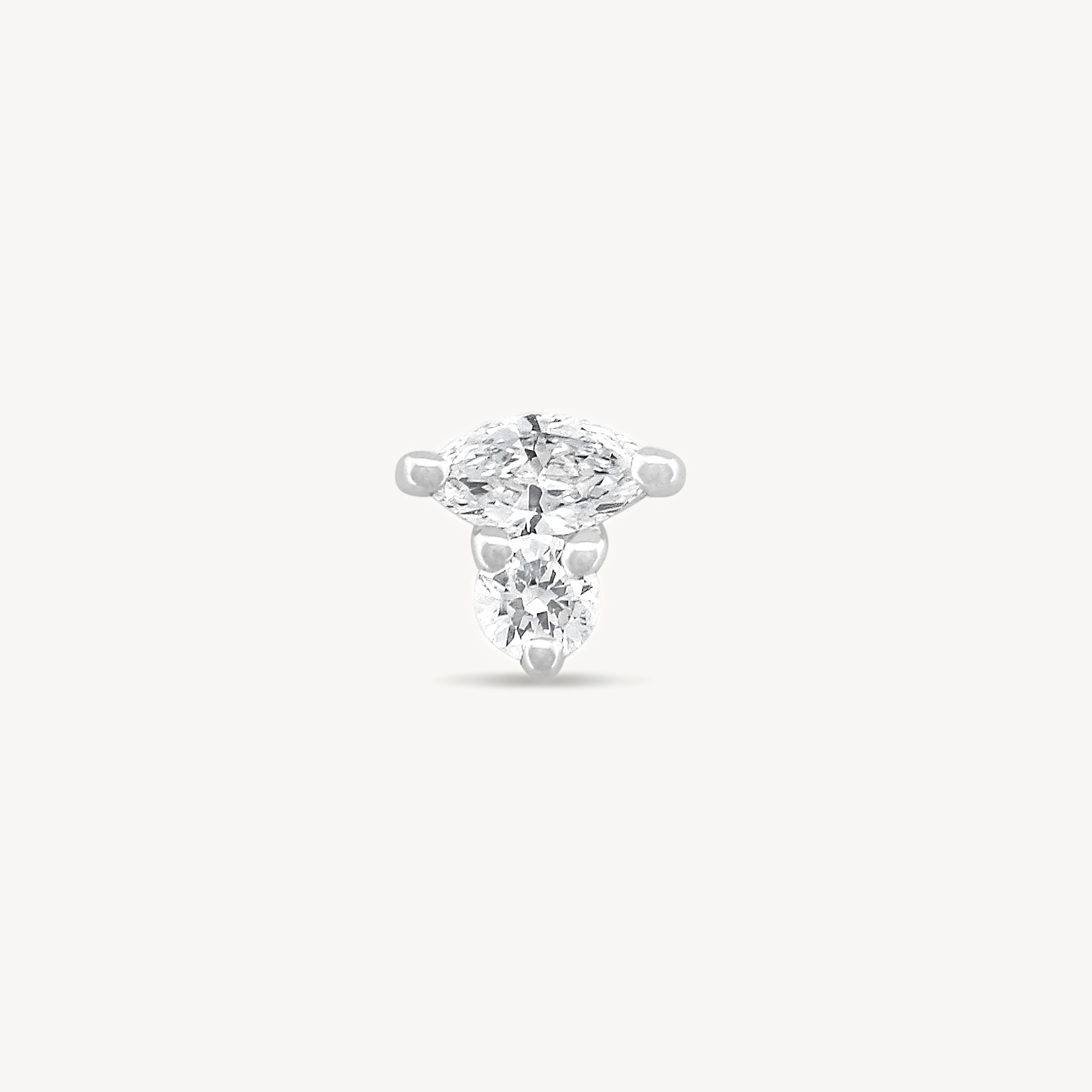 White gold Marquise and round Diamond stud earring with on a light gray background