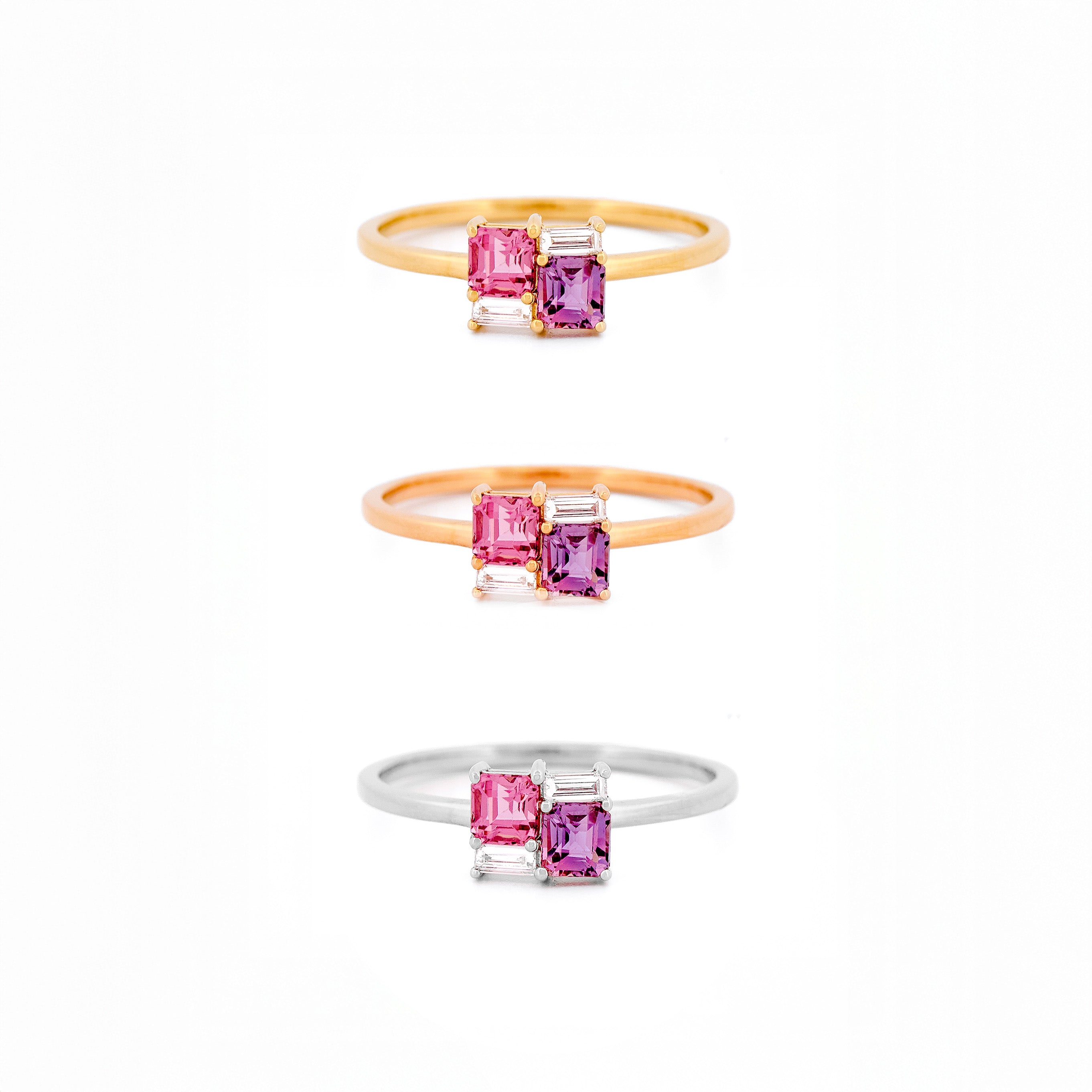 Three rings with pink sapphires and diamonds on a white background