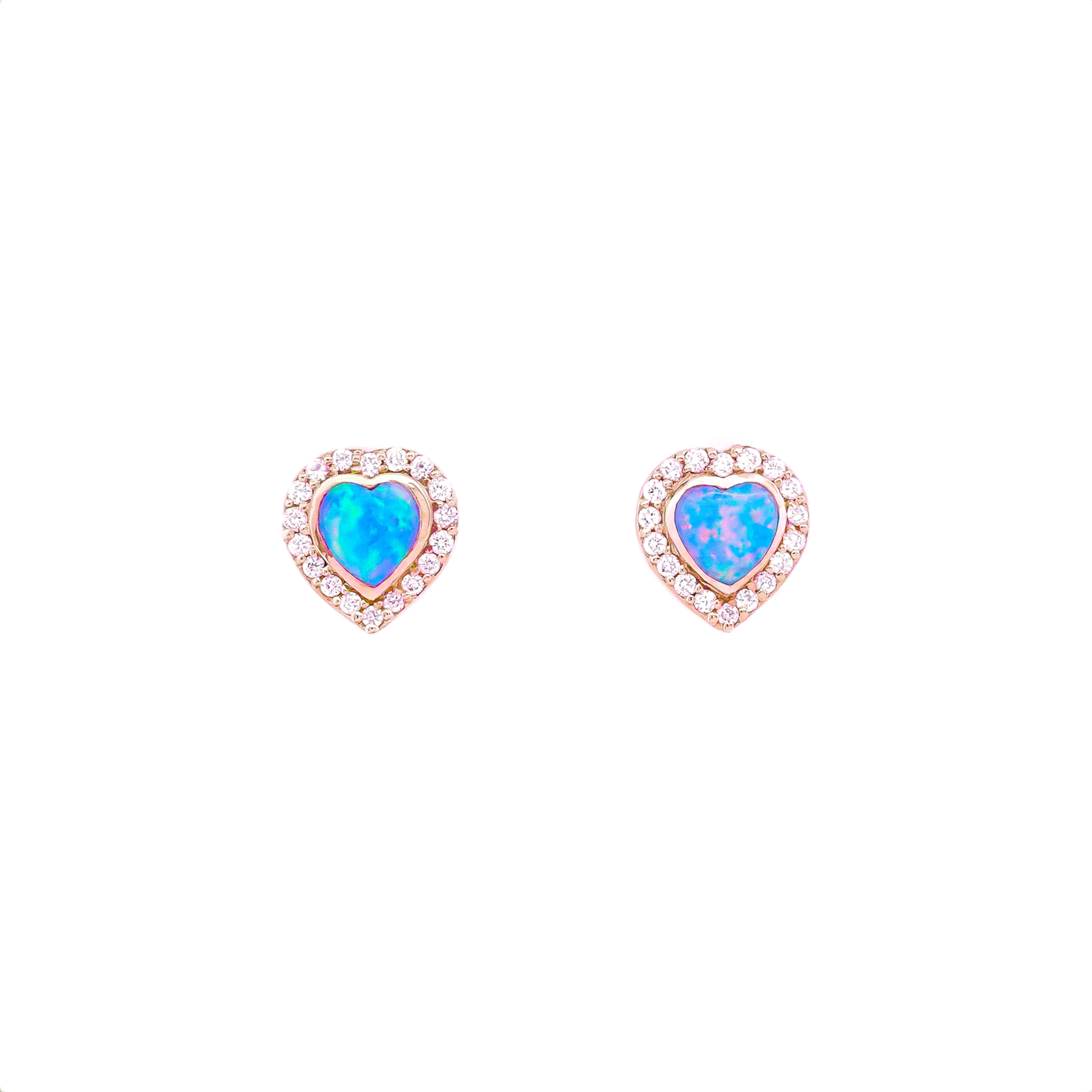 Heart-shaped Australian opal and Diamonds earrings in yellow gold on a white background