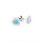 Heart-shaped Australian opal and Diamonds earrings in white gold on a white background