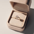 Rose cut Diamond ring in a beige jewelry box on a neutral background