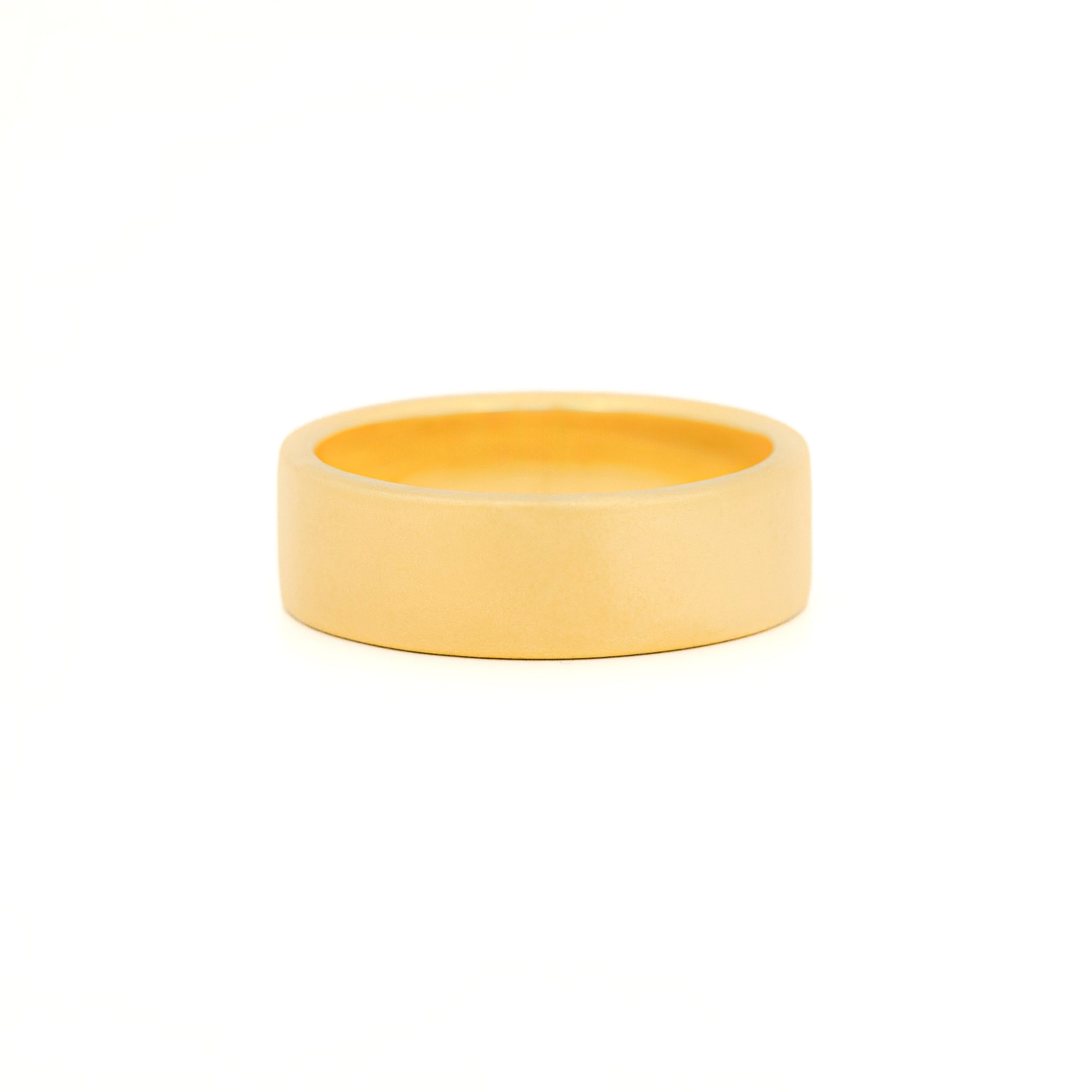 Gold 7mm wedding band with bezel diamonds morse code.