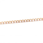 Gold bracelet with diamonds on a white background