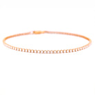 Rose gold bracelet with diamonds on a white background