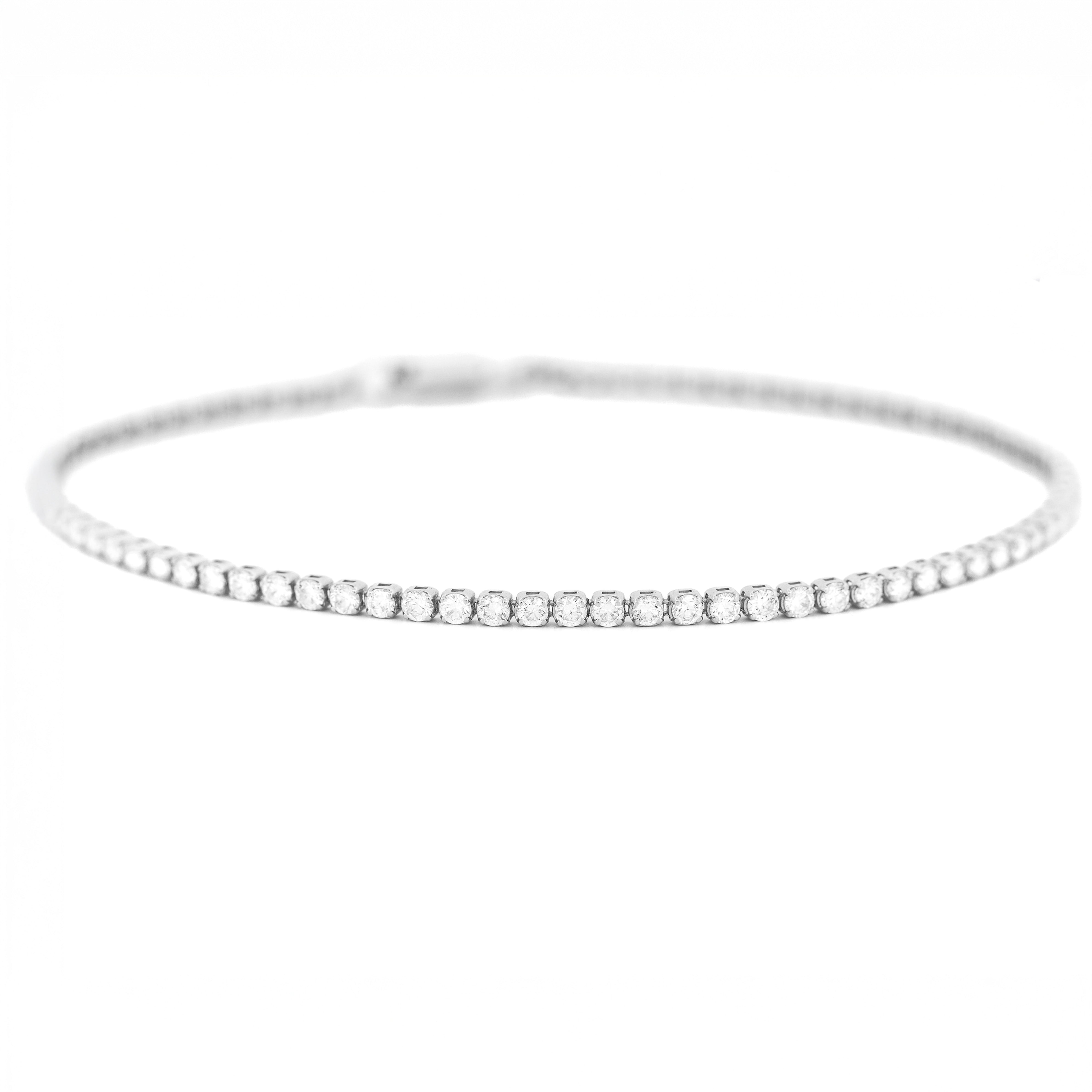 Whit gold bracelet with small with diamonds on a white background