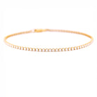 Gold bracelet with diamonds on a white background