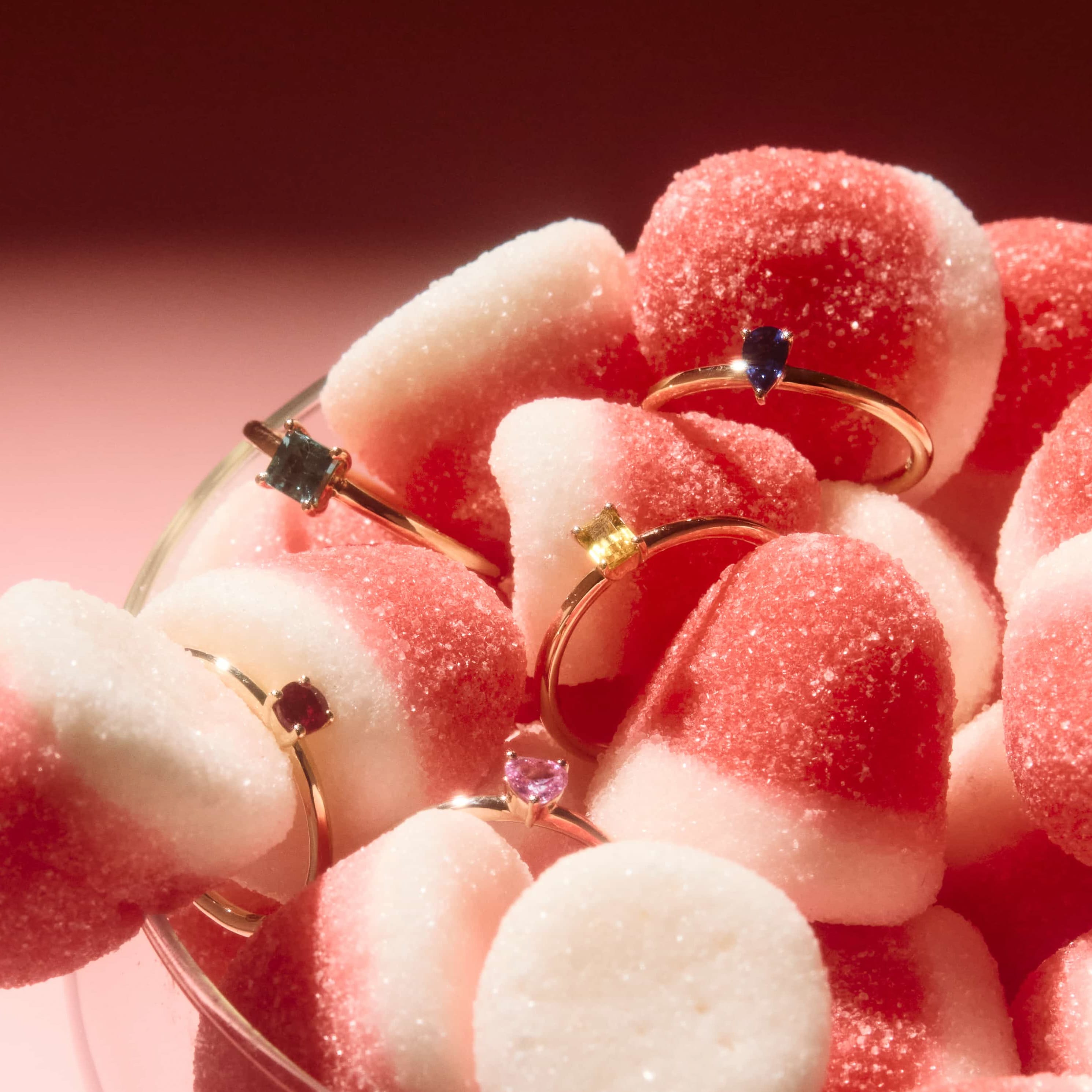 gold rings in a candy filled bowl. 