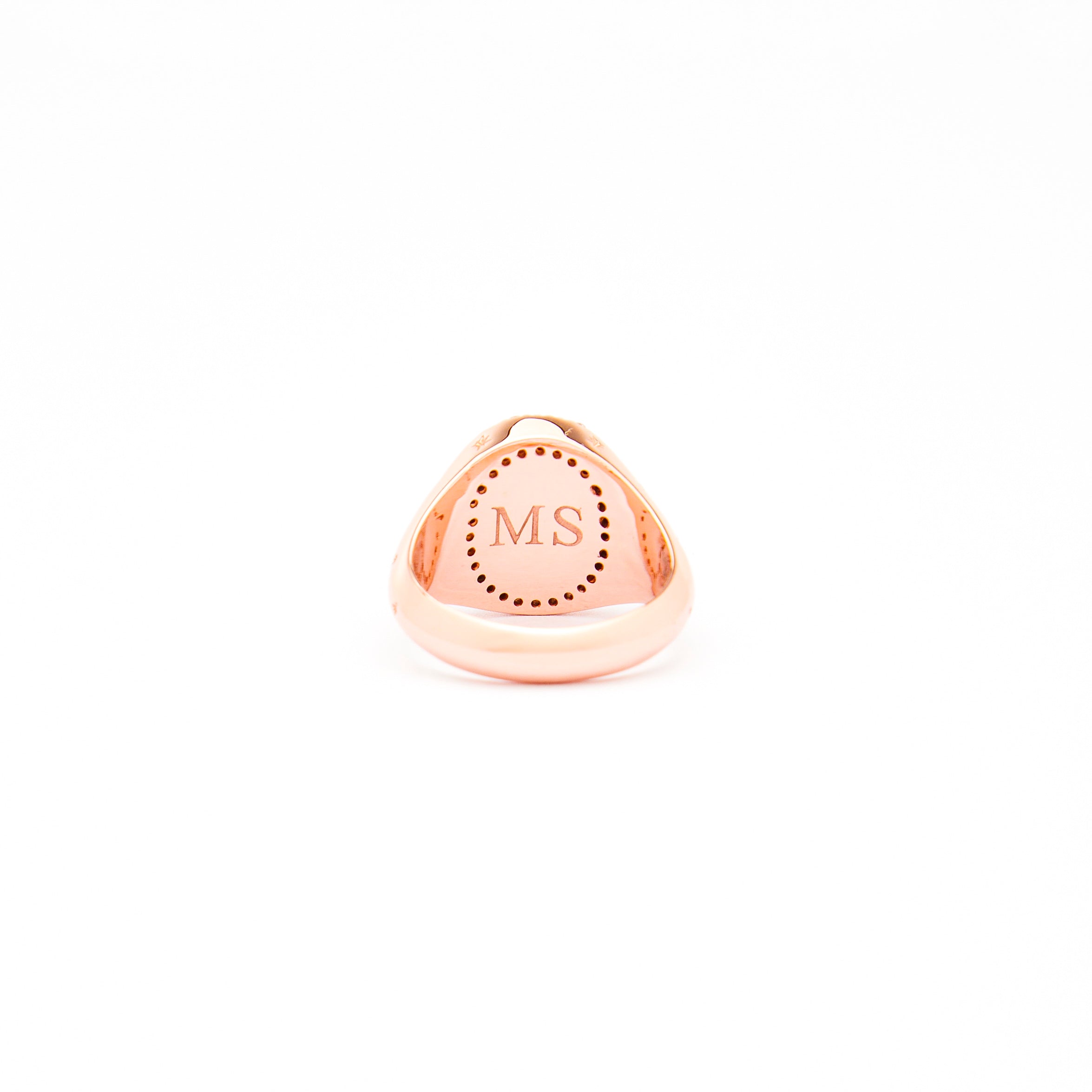 An Australian Opal and Diamonds Signet Ring in rose gold with the opal as the centrepiece, surrounded by white diamonds and an engraving on the back with letters M and S.