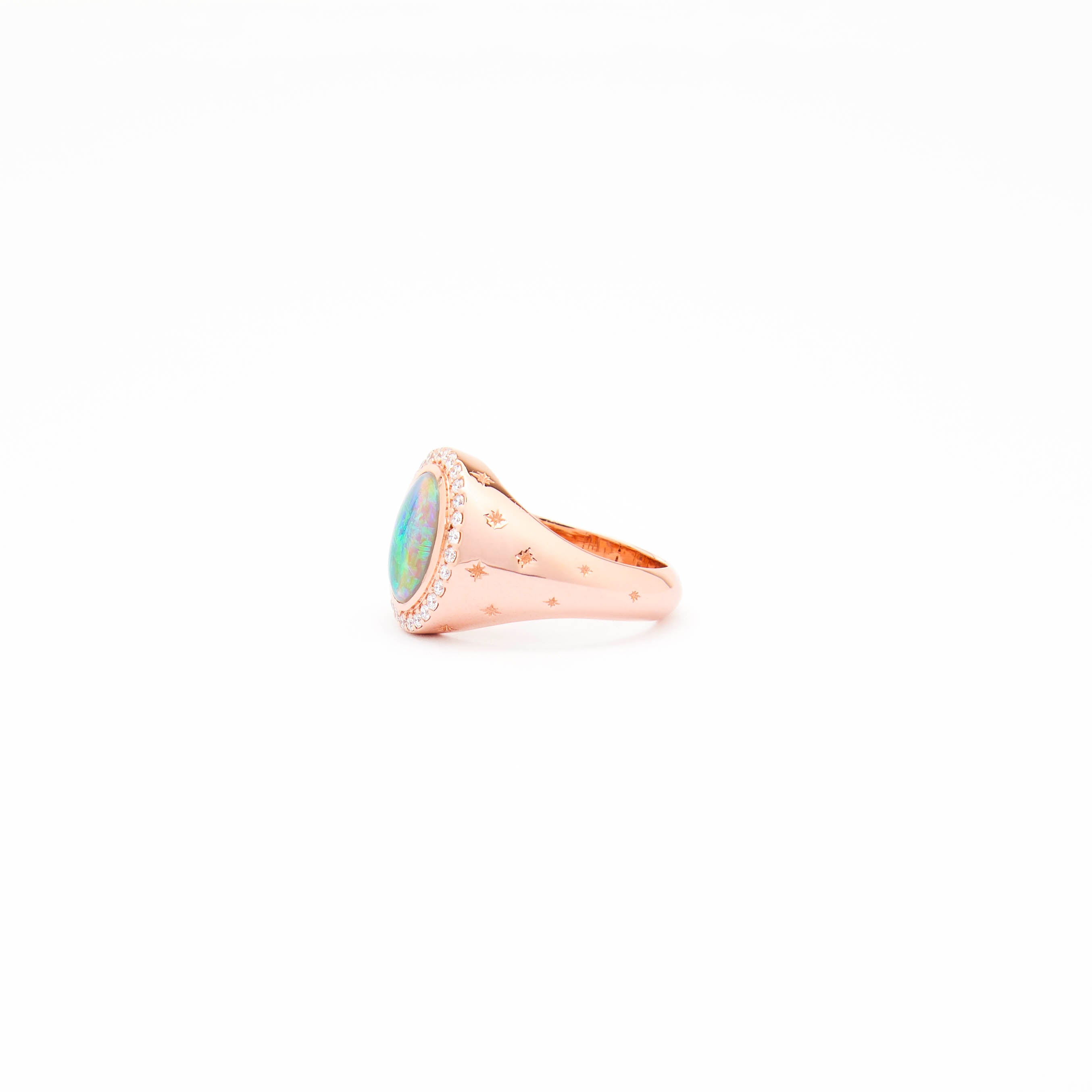 An Australian Opal and Diamonds Signet Ring in rose gold with the opal as the centrepiece, surrounded by white diamonds and set on a white background.