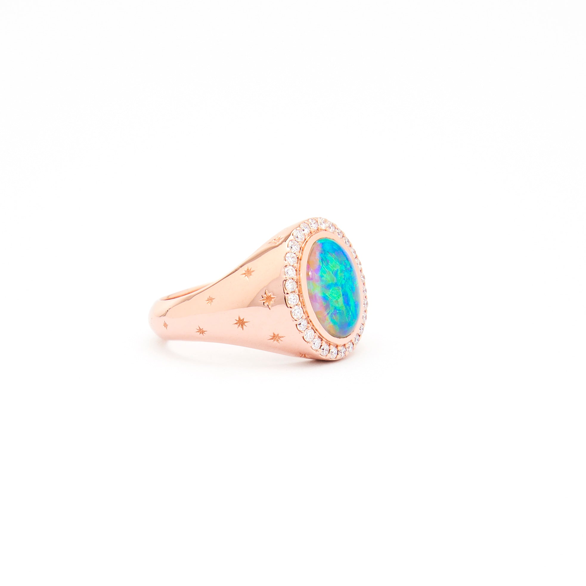 An Australian Opal and Diamonds Signet Ring in rose gold with the opal as the centrepiece, surrounded by white diamonds and set on a white background.