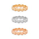 Three braided rings in yellow gold, rose gold, and white gold on a white background
