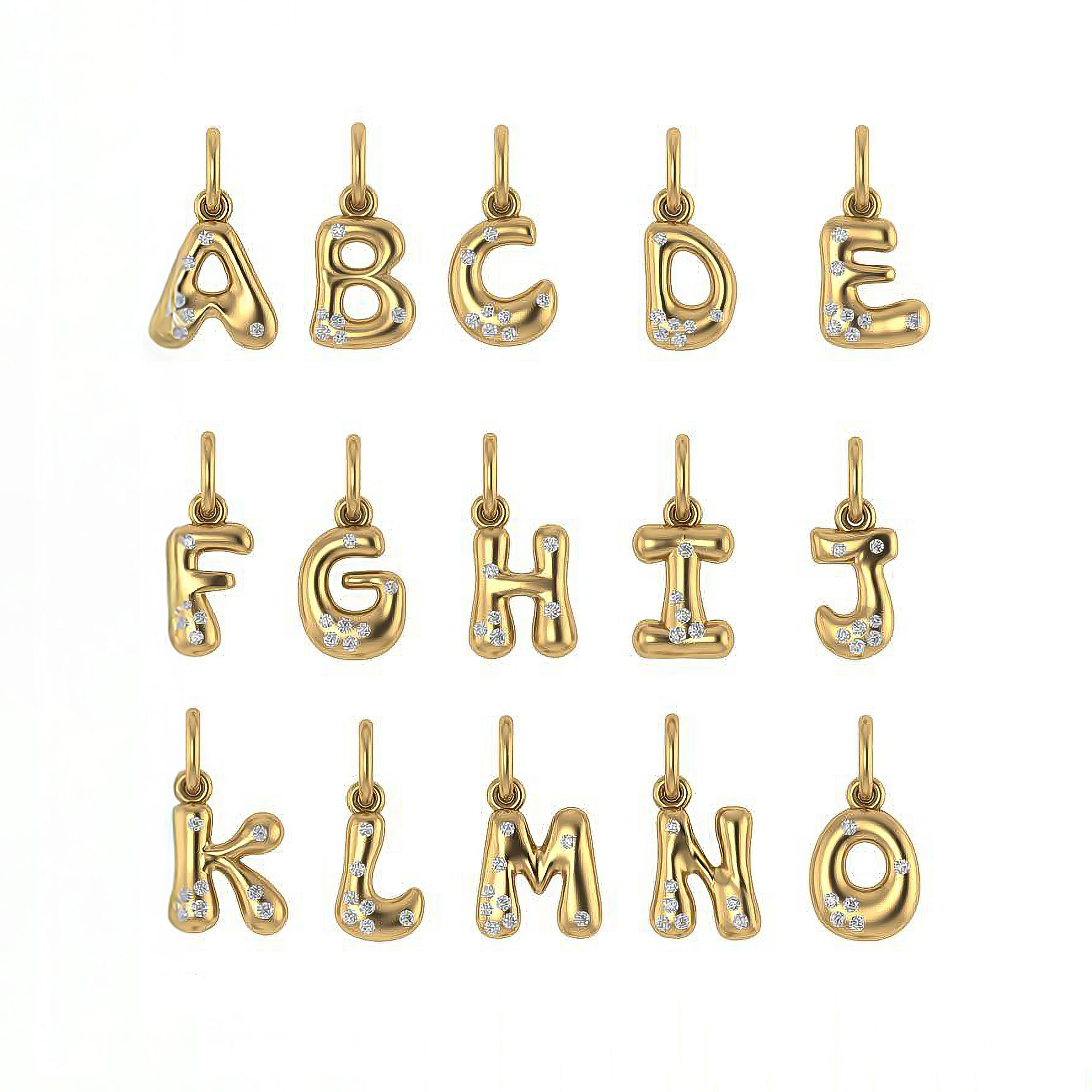 Gold letter pendants with sprinkled diamonds on a white background