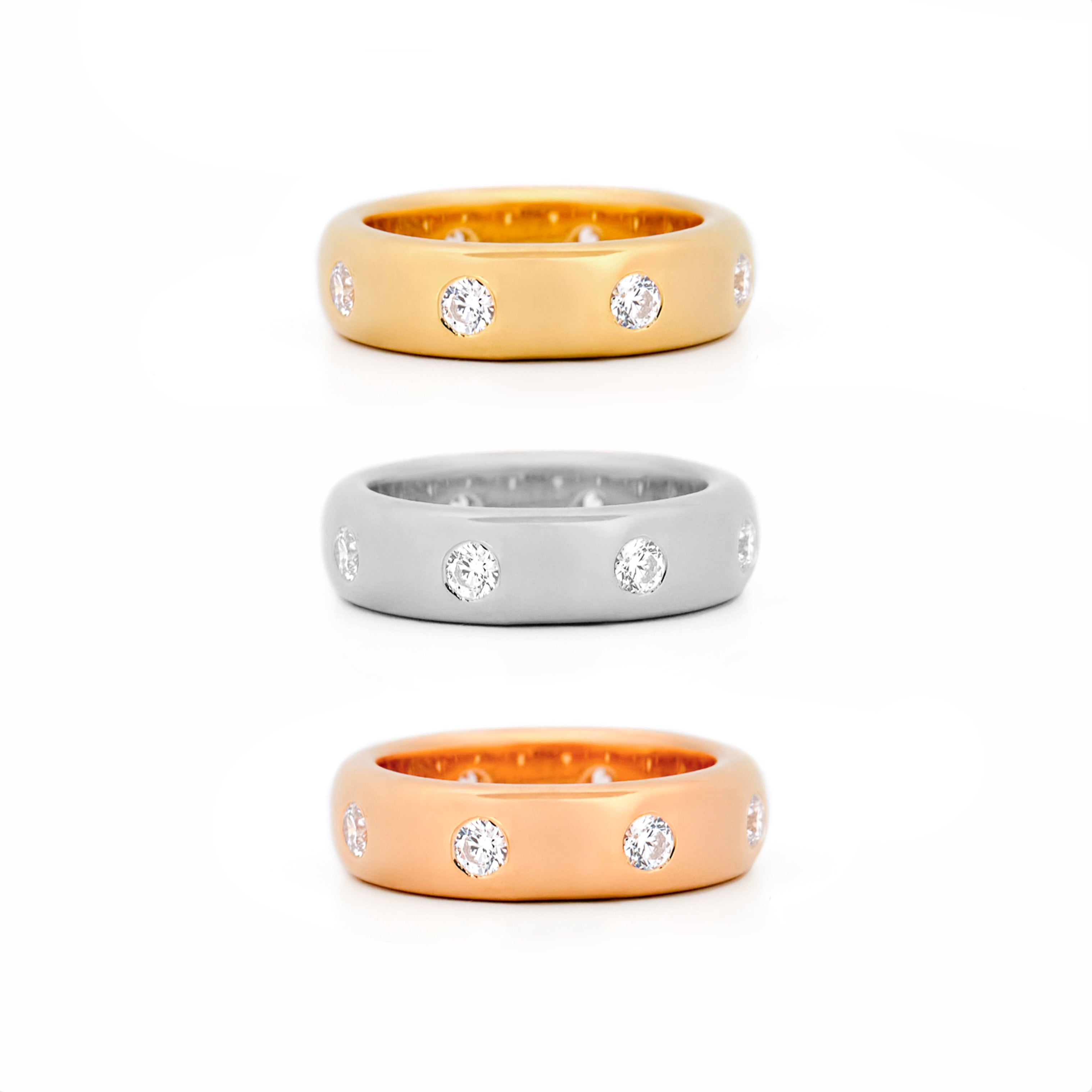 Chubby Gold rings, in all gold colours, with bezel diamonds on a white background
