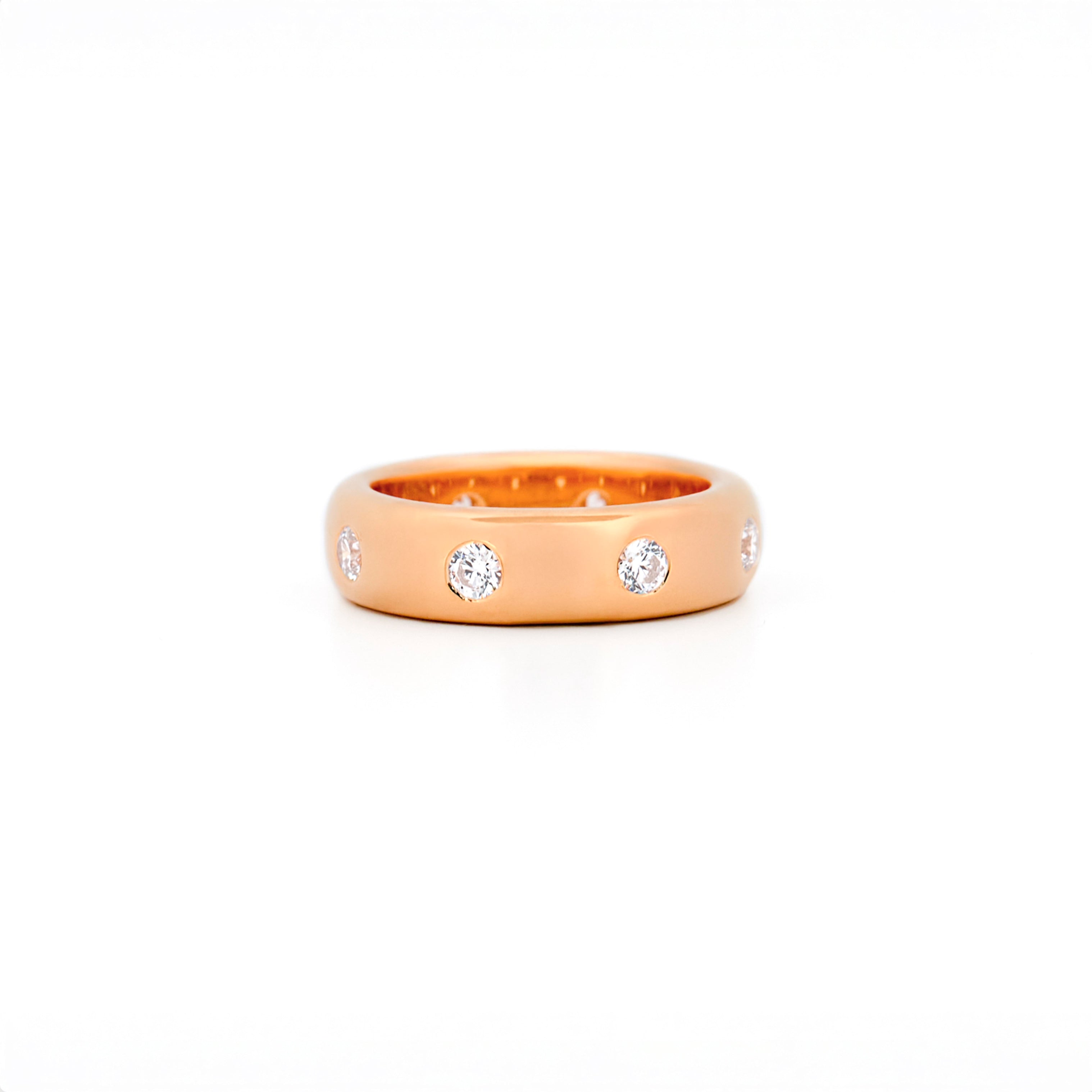 Chubby Gold ring with bezel diamonds on a white background