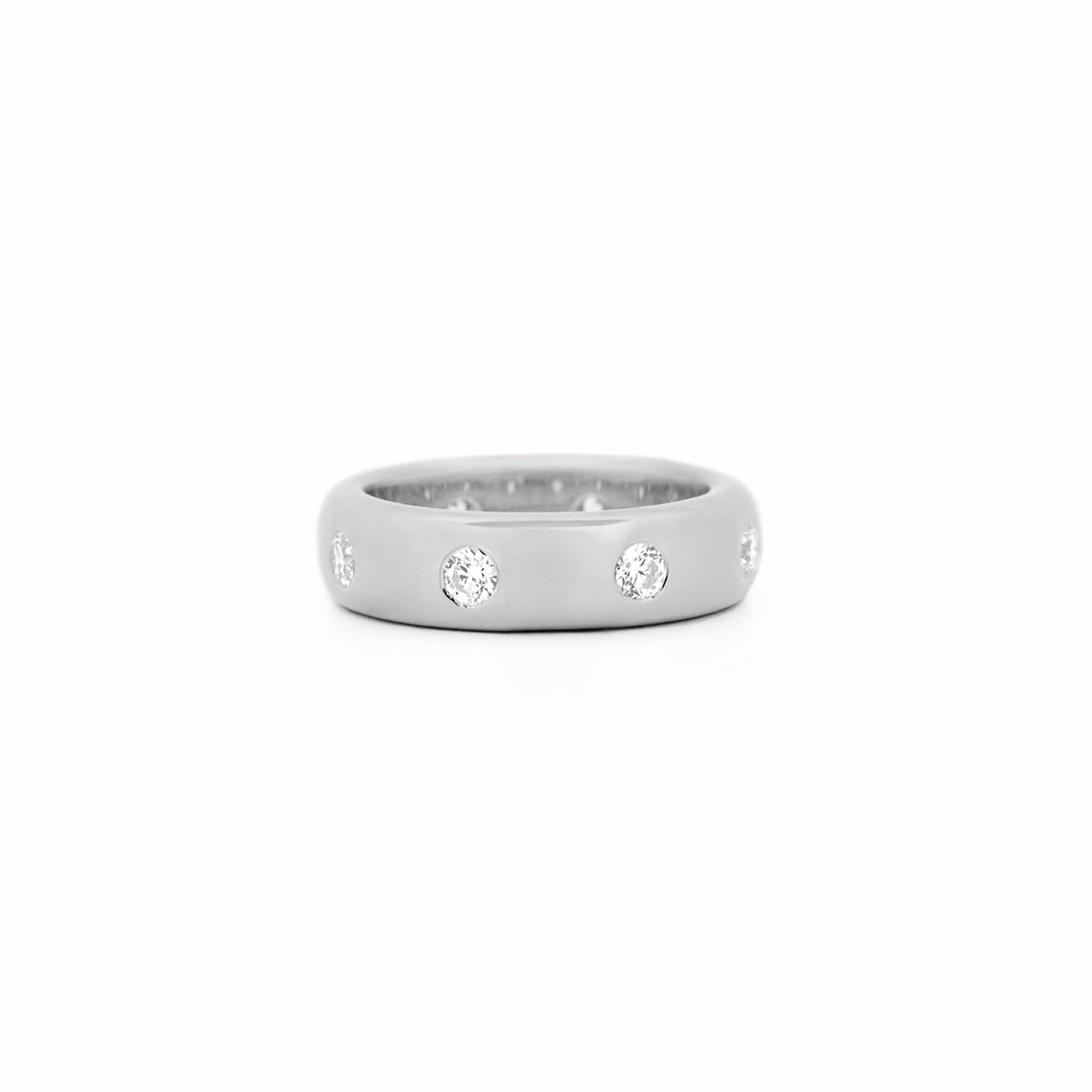 Chubby Gold ring with bezel diamonds on a white background