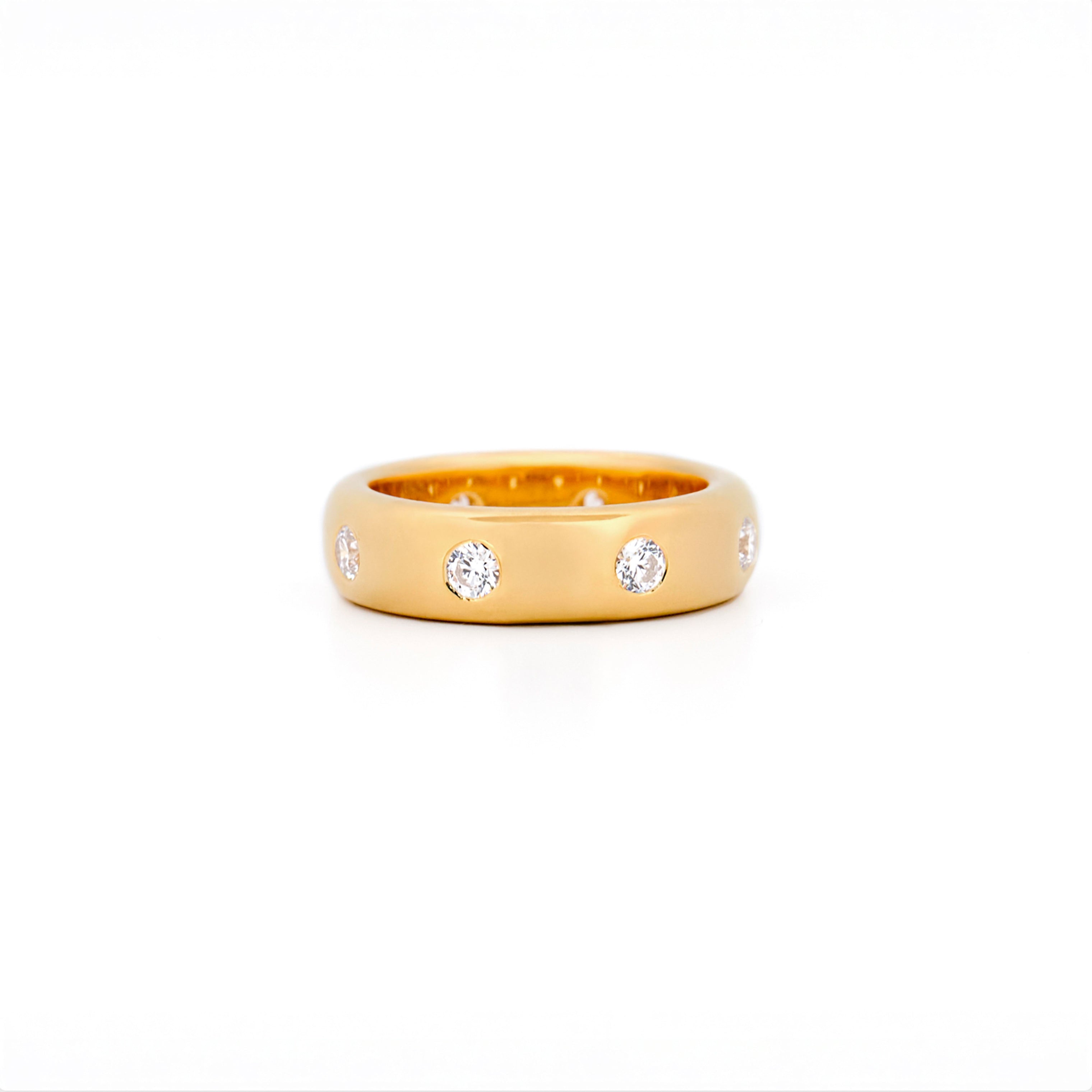 Chubby Gold ring with bezel diamonds on a white background