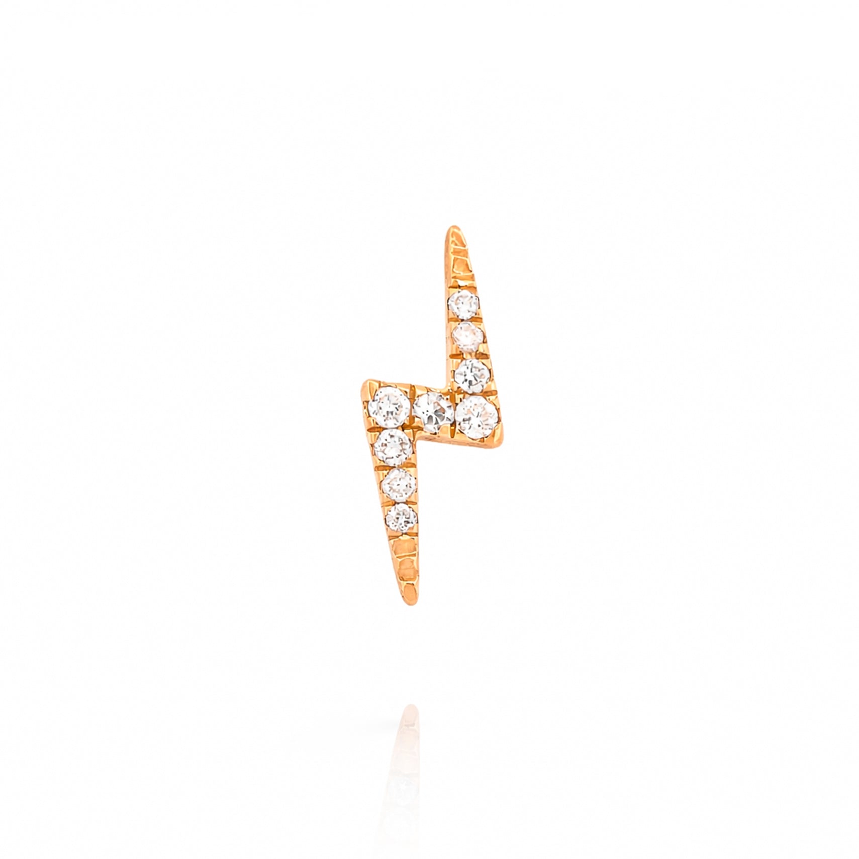 Rose gold lightning bolt earring with diamonds on a white background